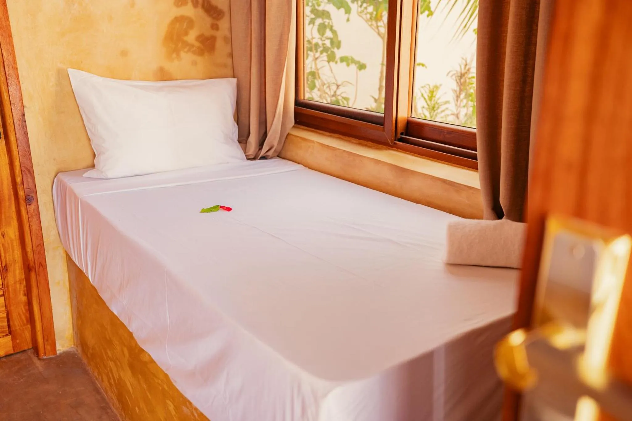 Bed in Mayai Ocean Resort