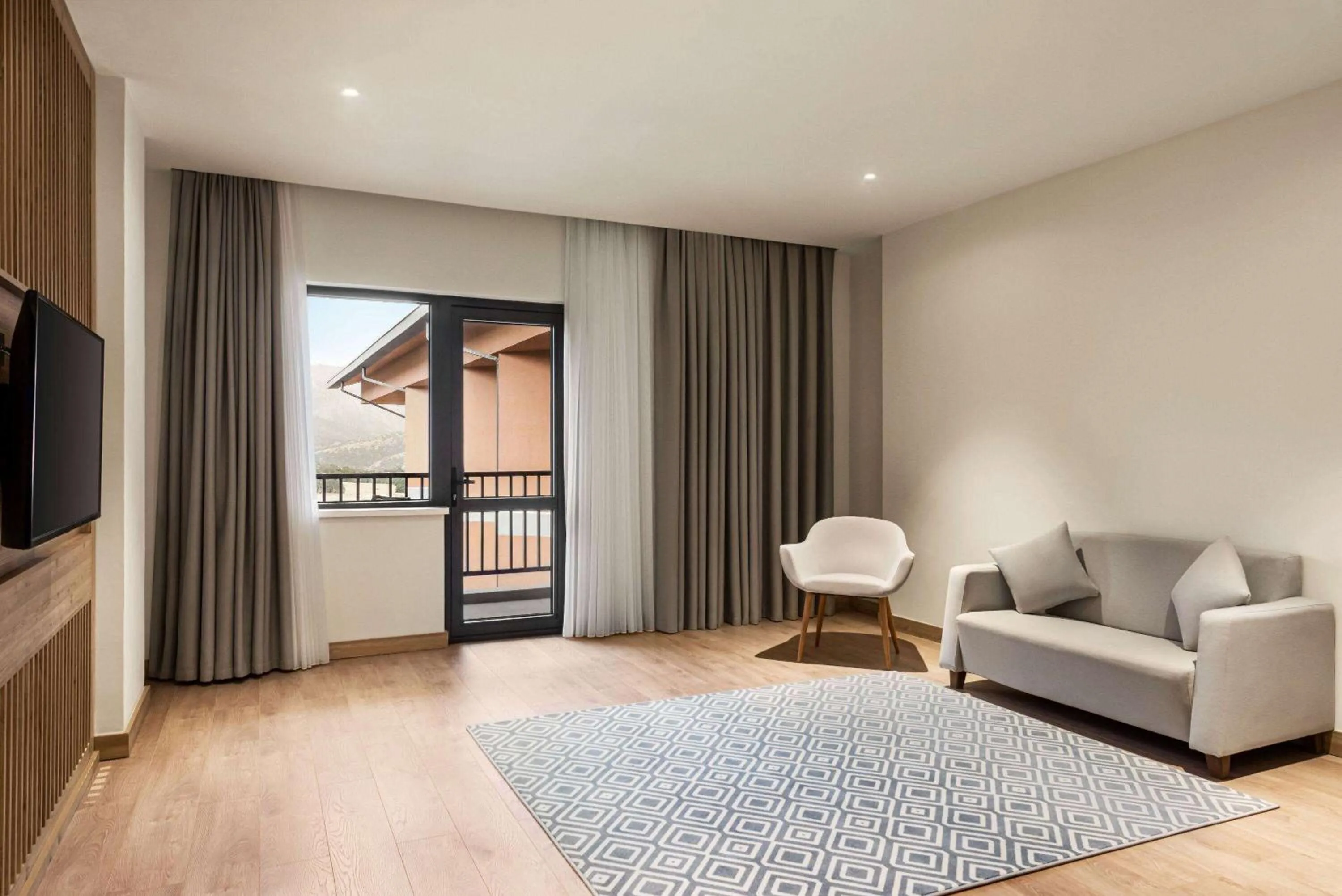 Bed in Ramada Encore by Wyndham Zomin