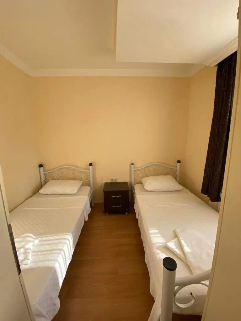 Bed in Tulip Apart Hotel