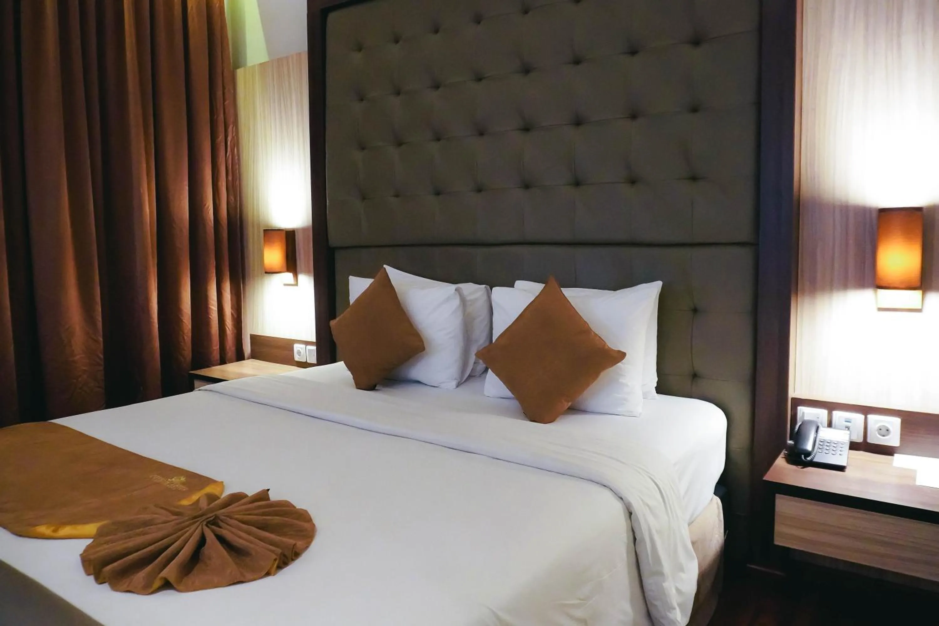 Bed in Crystal Lotus Hotel Yogyakarta