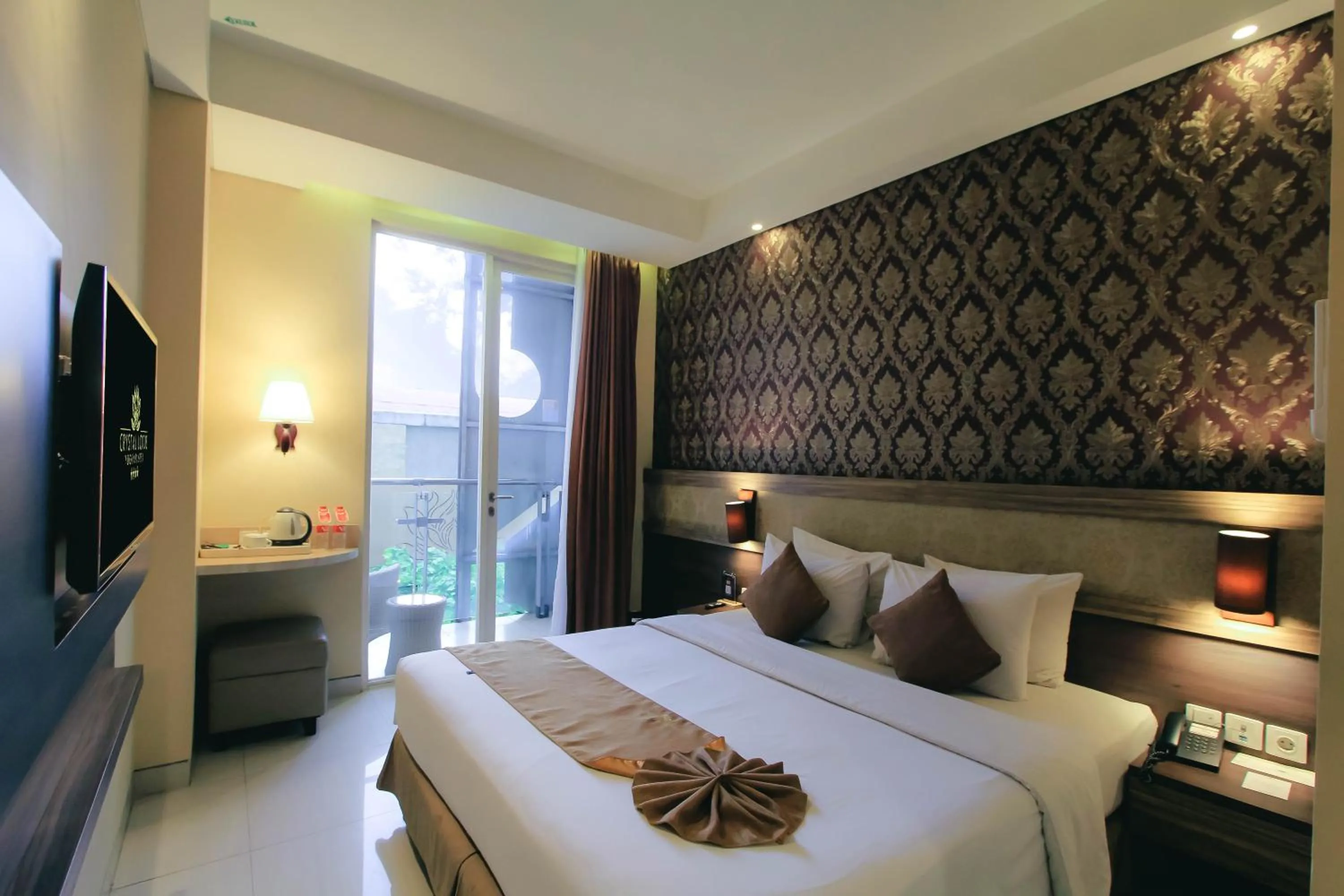 Bed in Crystal Lotus Hotel Yogyakarta