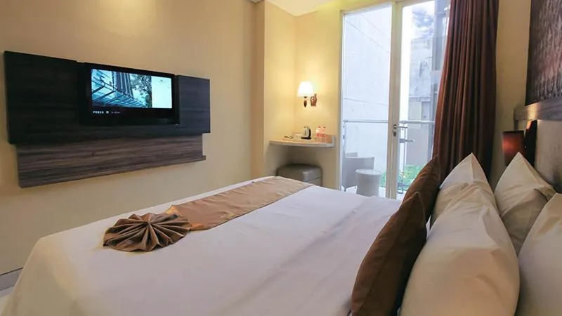 Bed in Crystal Lotus Hotel Yogyakarta