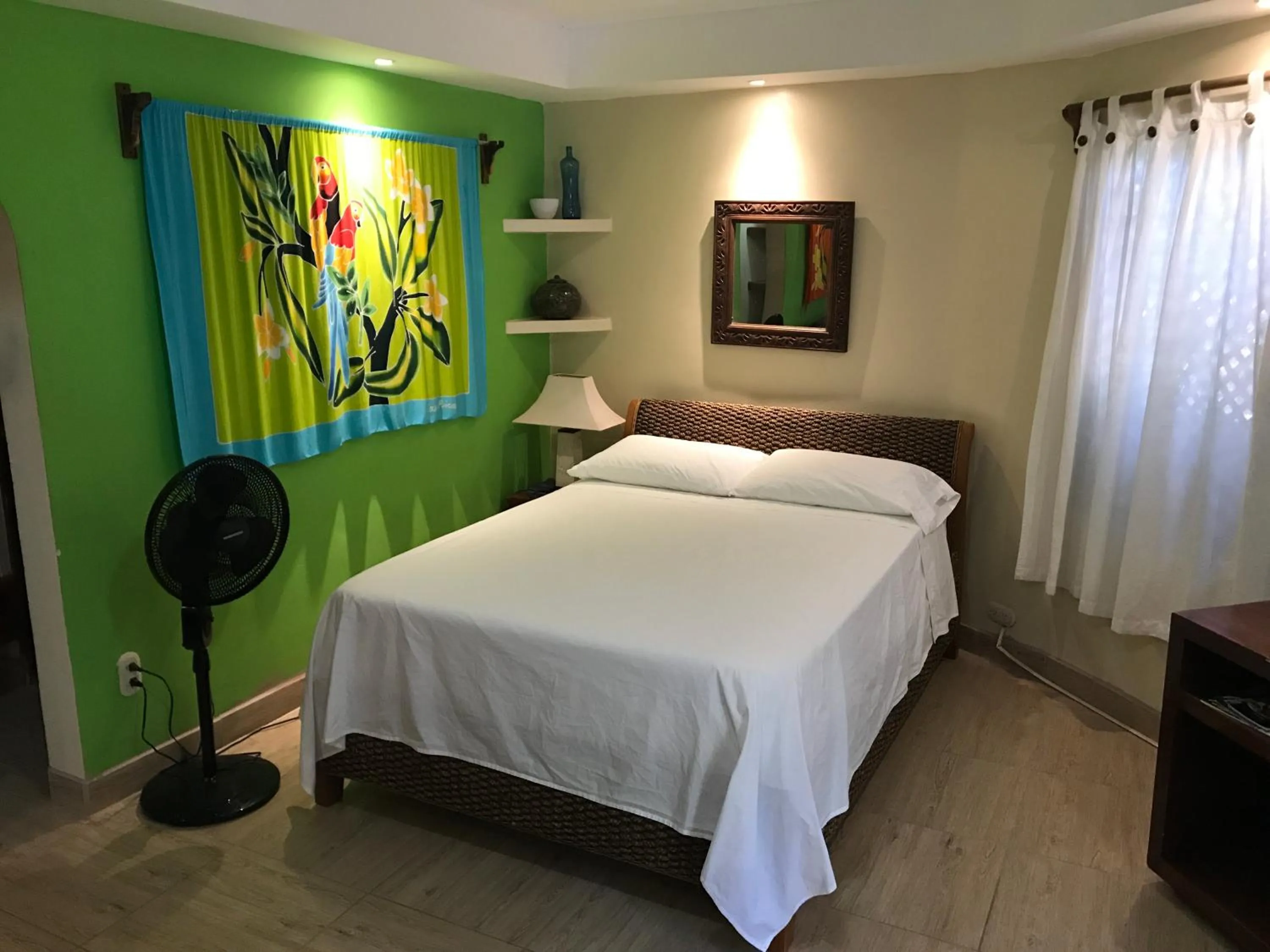 Bed in Tamarindo Village Hotel