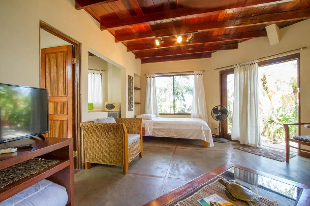 Bed in Tamarindo Village Hotel