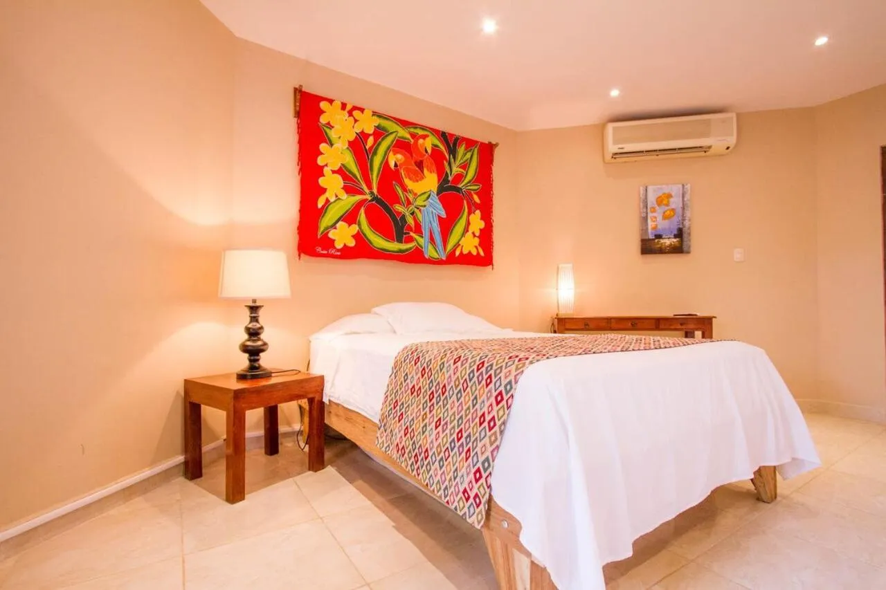 Bed in Tamarindo Village Hotel
