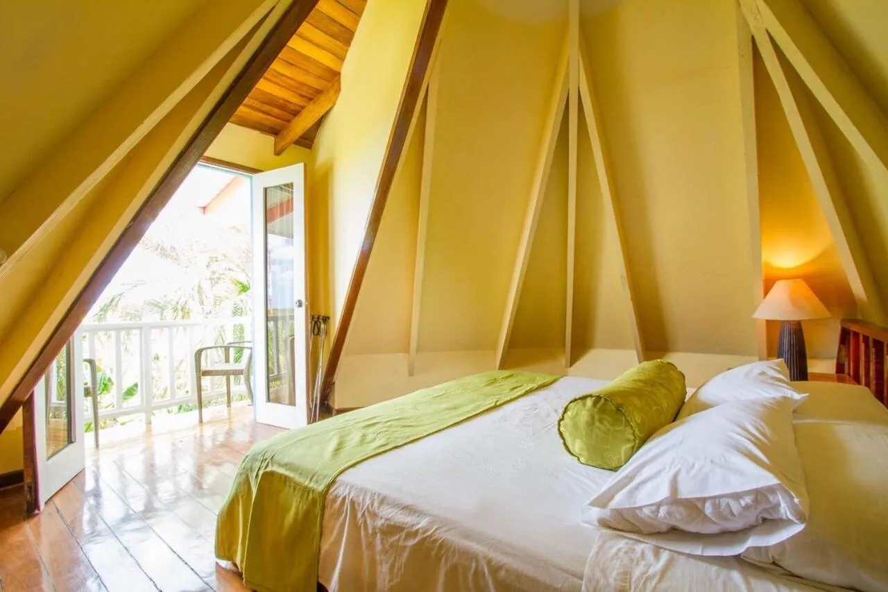 Bed in Tamarindo Village Hotel