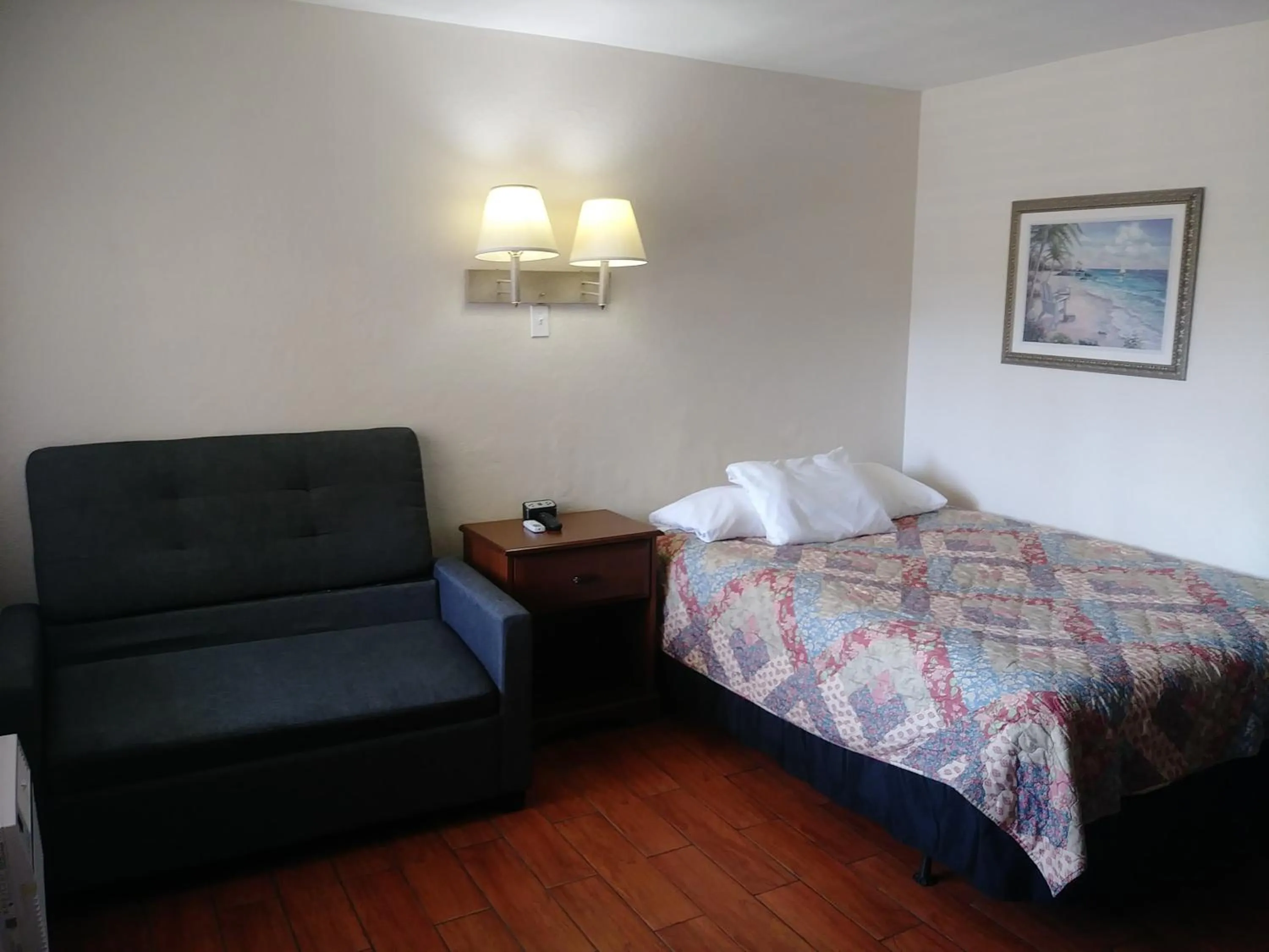 Bed in Palm Breeze Hotel