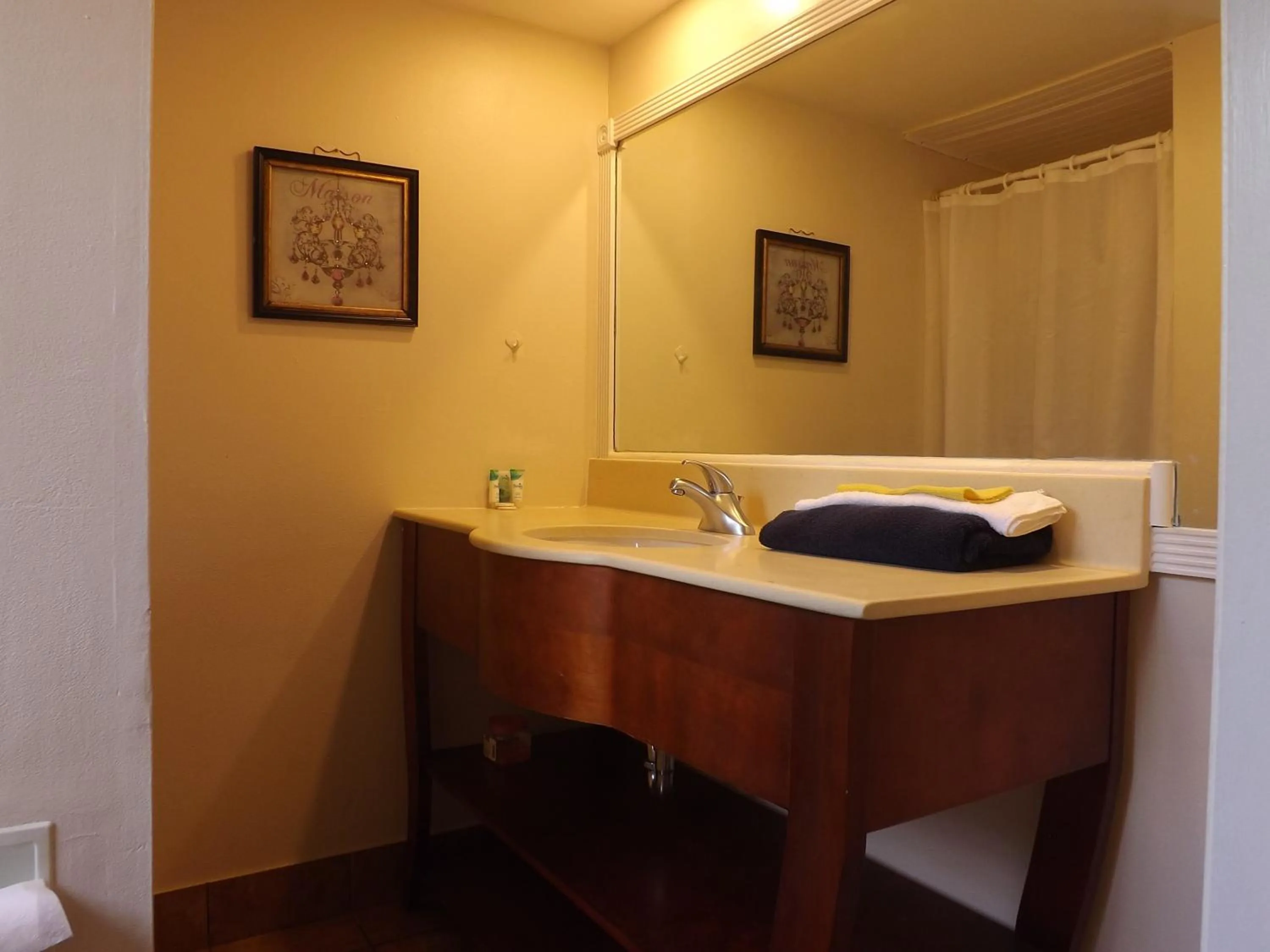 Bed in Palm Breeze Hotel