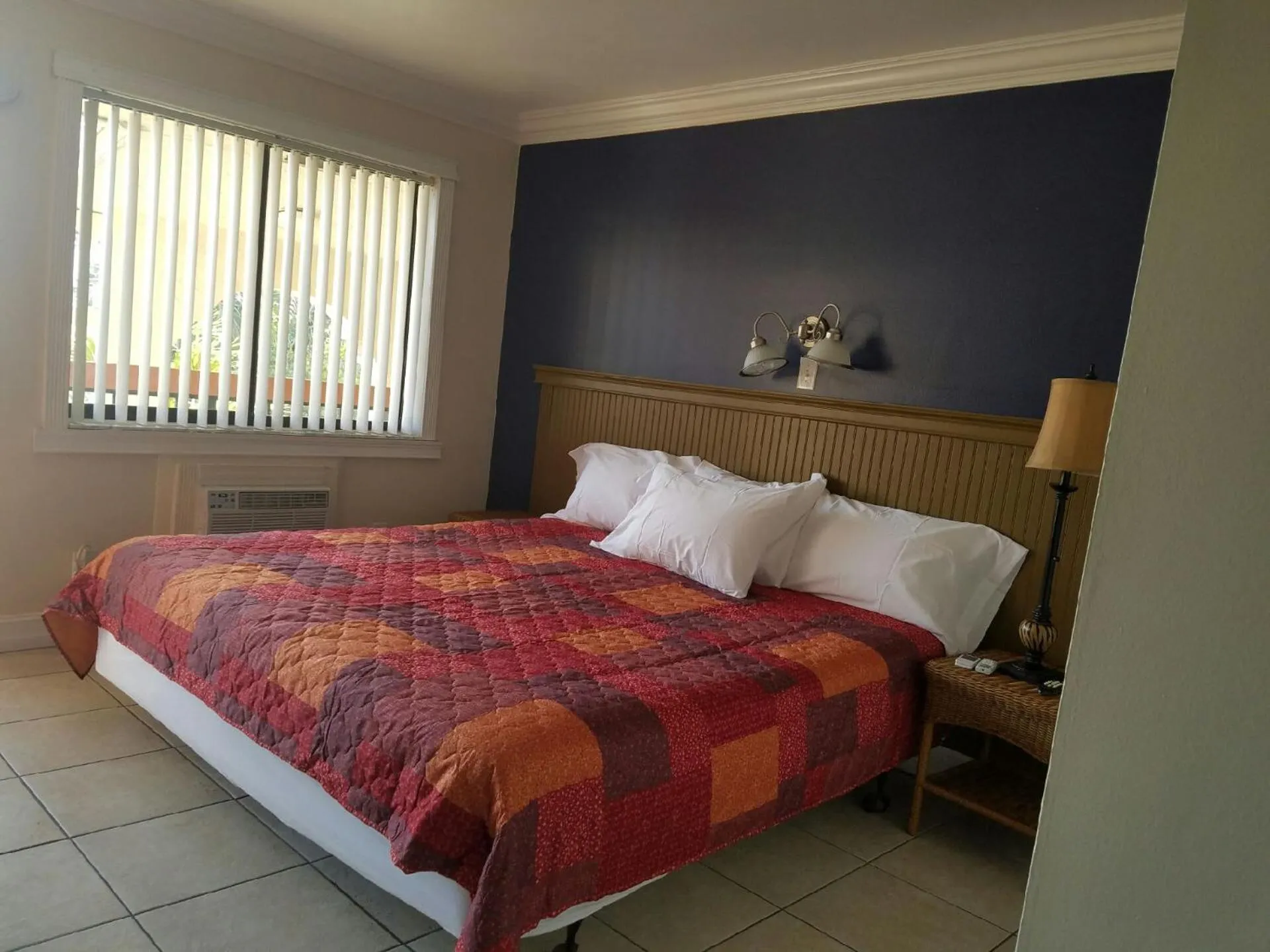 Bed in Palm Breeze Hotel