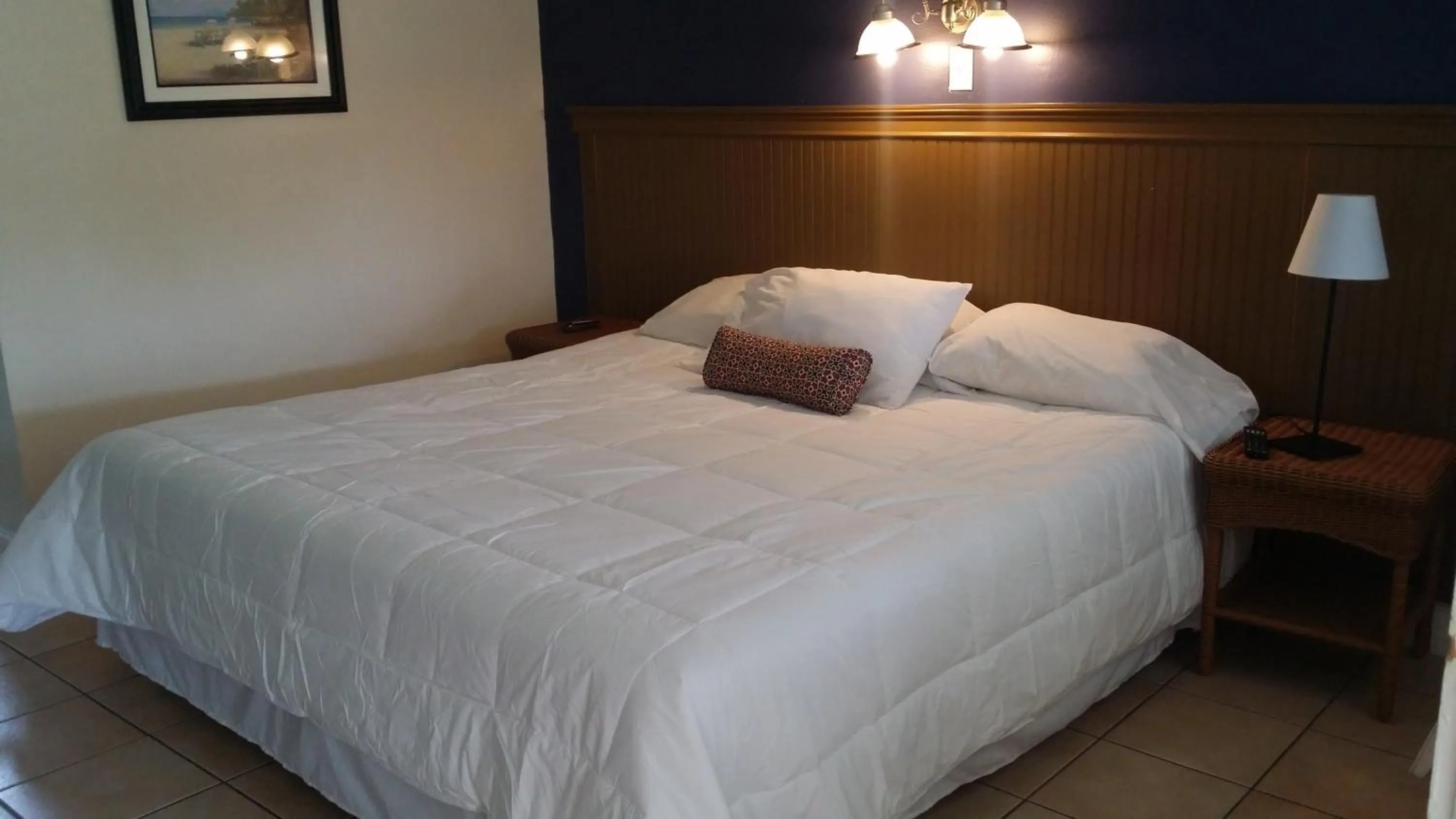 Bed in Palm Breeze Hotel