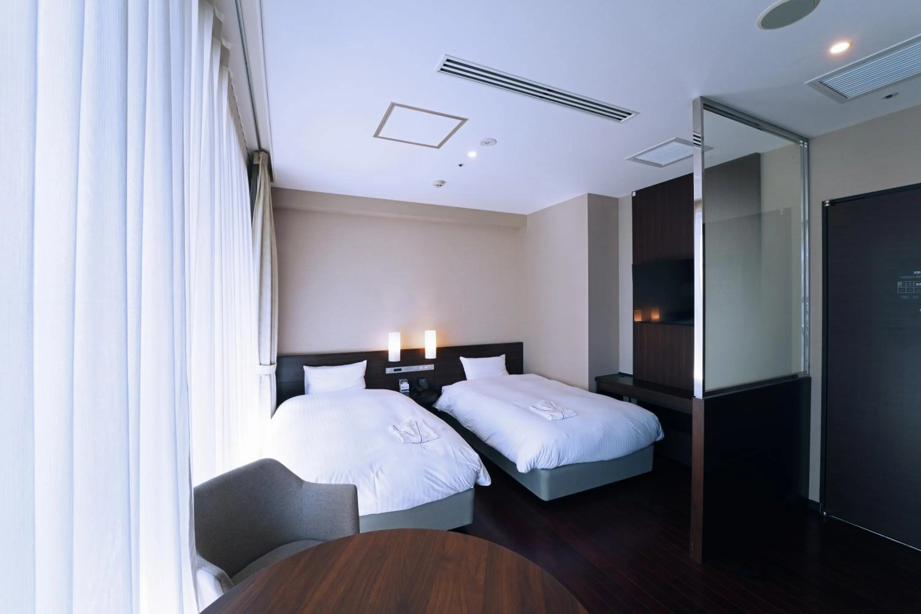 Photo of the whole room, Bed in KOKO HOTEL Sendai Kotodai Park