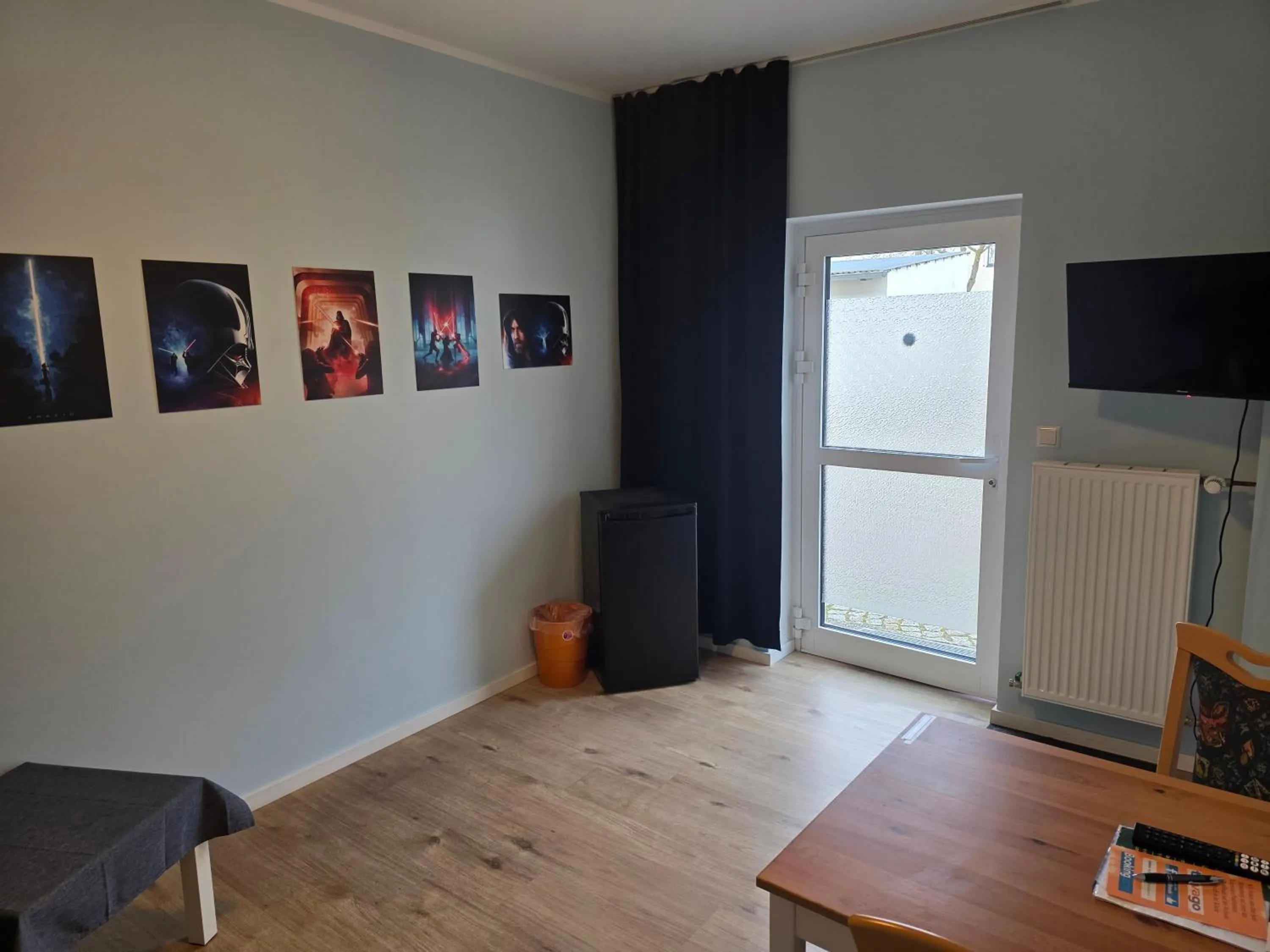 Communal lounge/ TV room in Pension am Filmpark