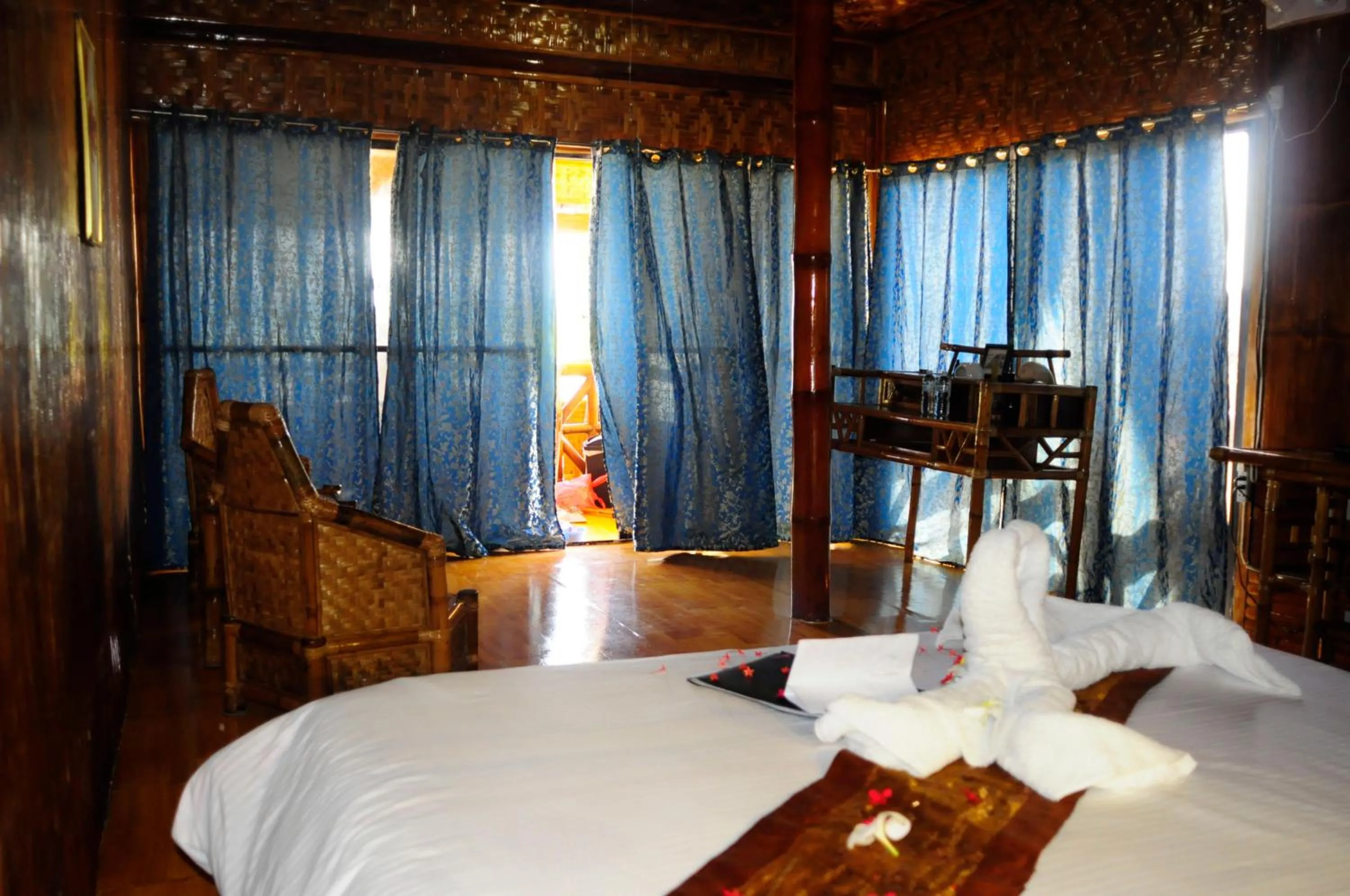 Photo of the whole room, Bed in The Coral Blue Oriental Beach Villas and Suites