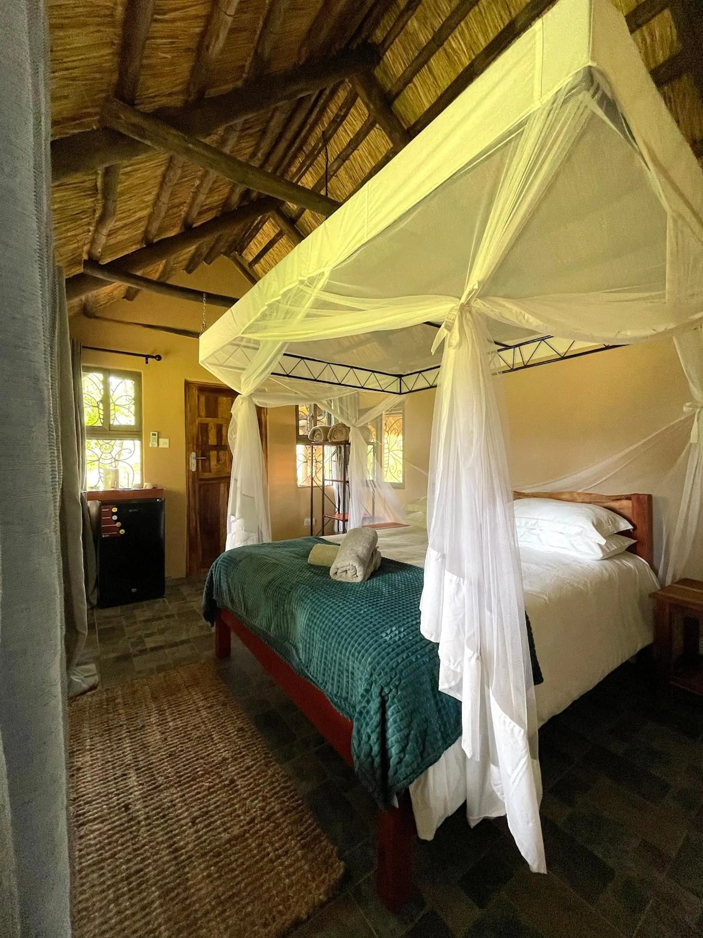Bed in Maramba River Lodge