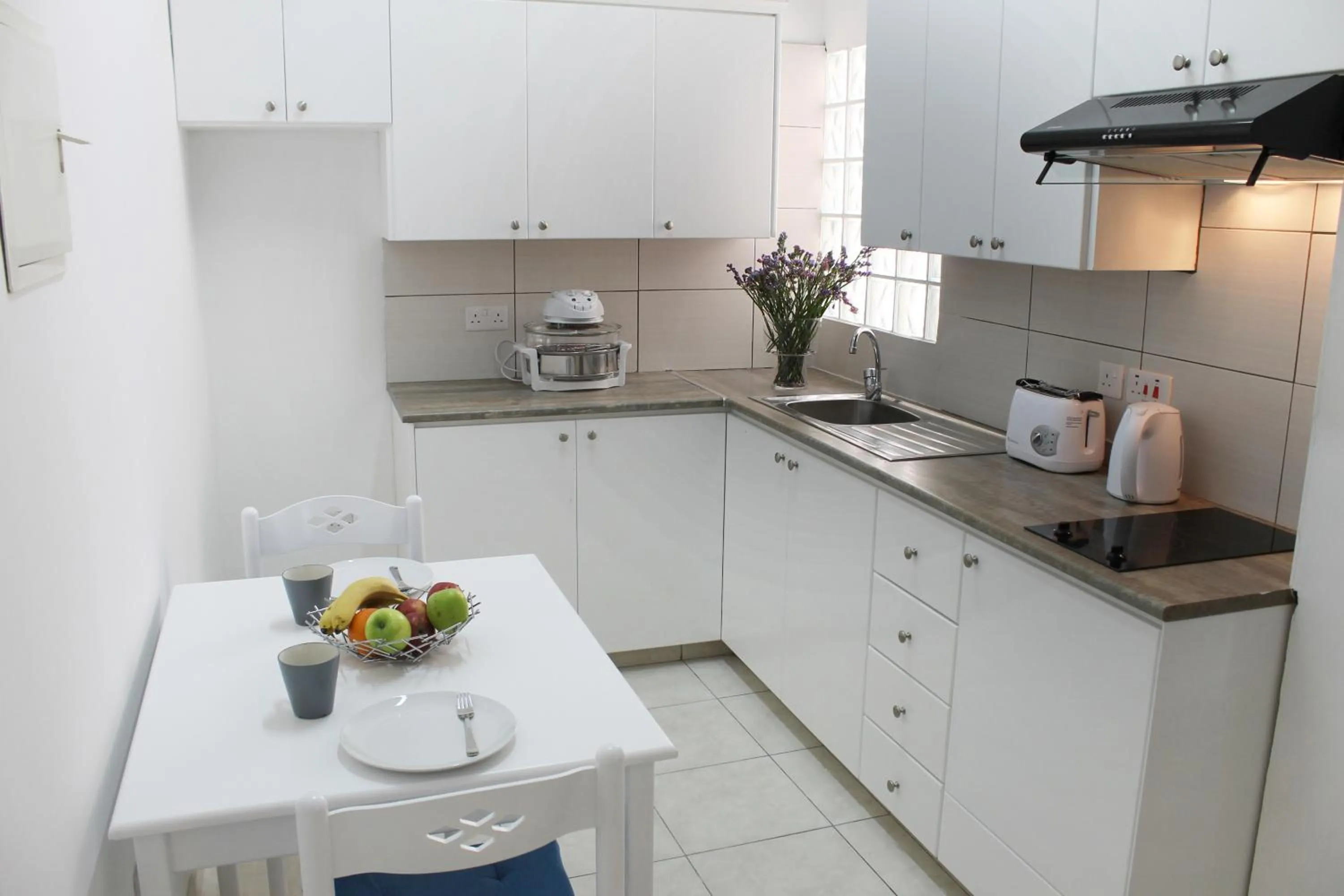 Kitchen or kitchenette in Stephanie City Apartments