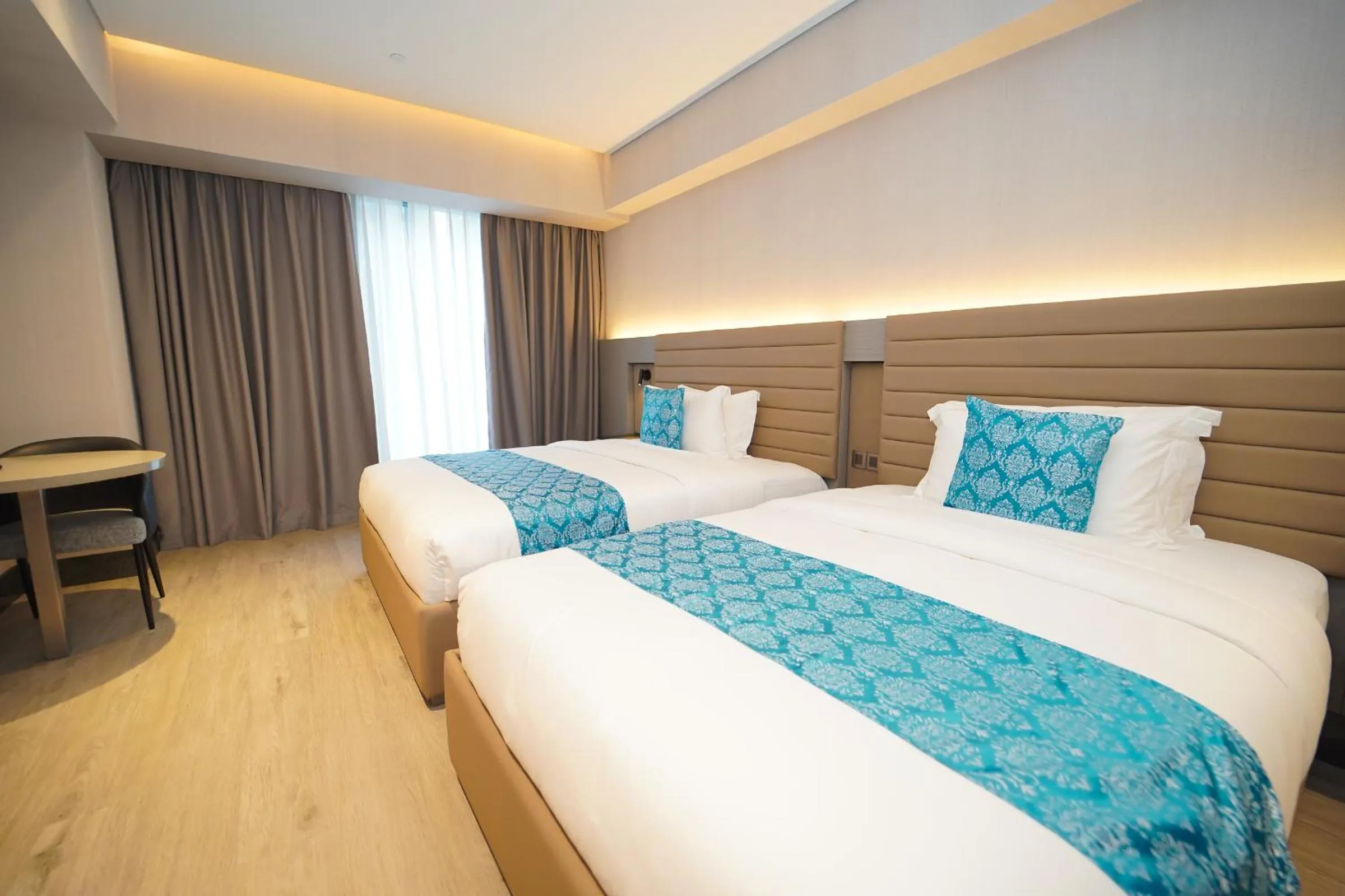 Bed in Bayprime Hotel