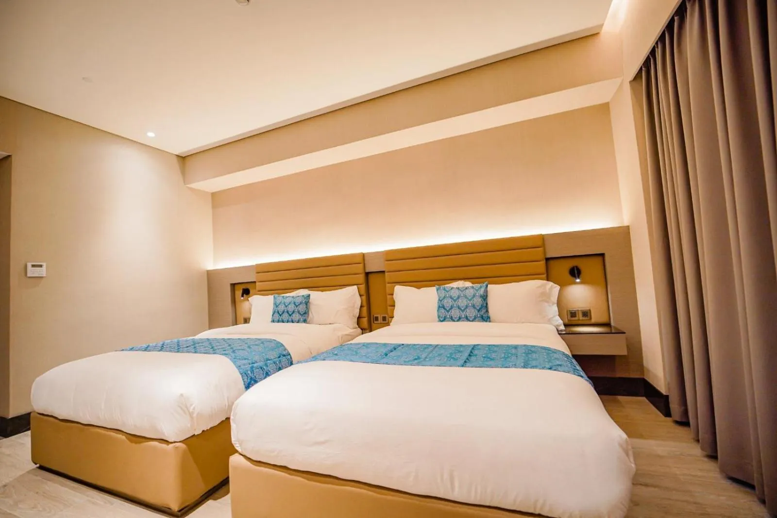 Bed in Bayprime Hotel