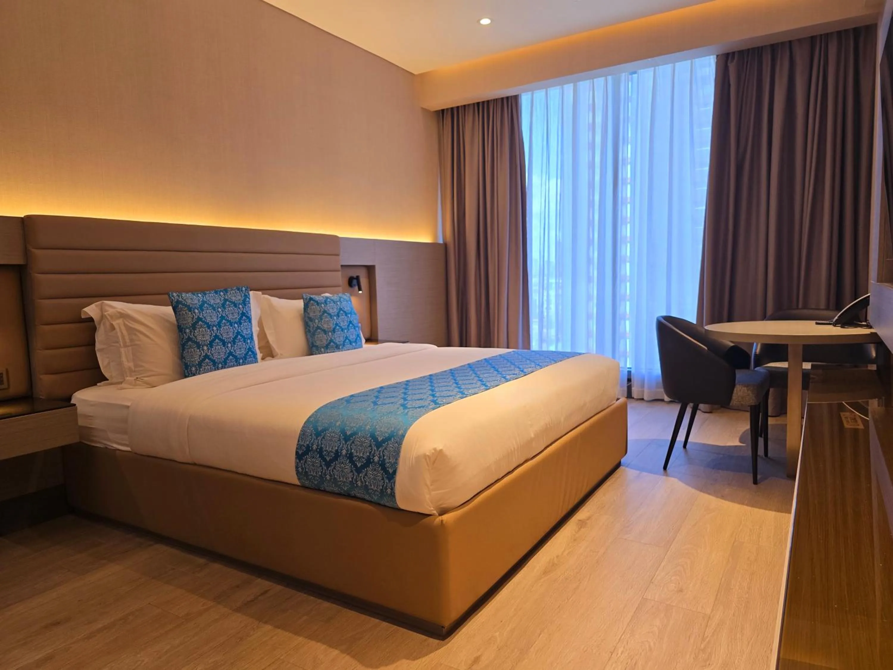 Bed in Bayprime Hotel