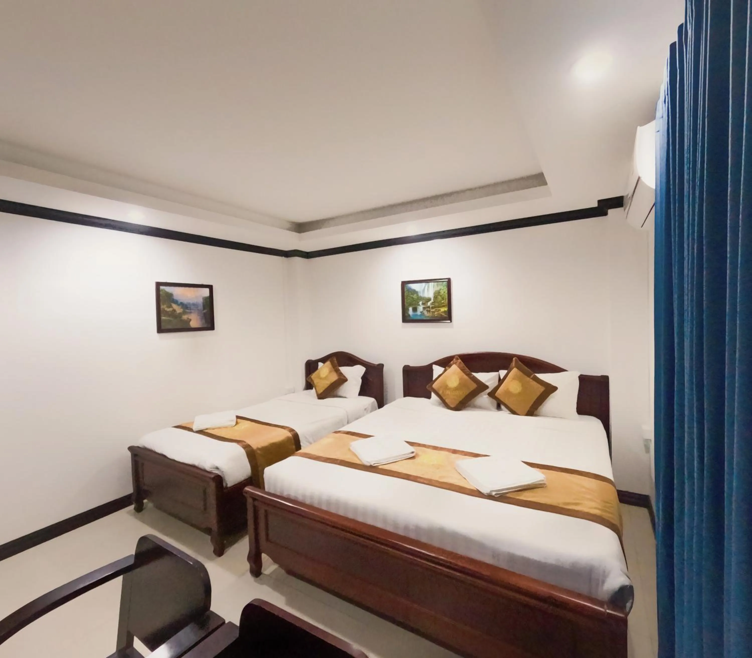 Photo of the whole room, Bed in Vang Vieng Consiana Hotel