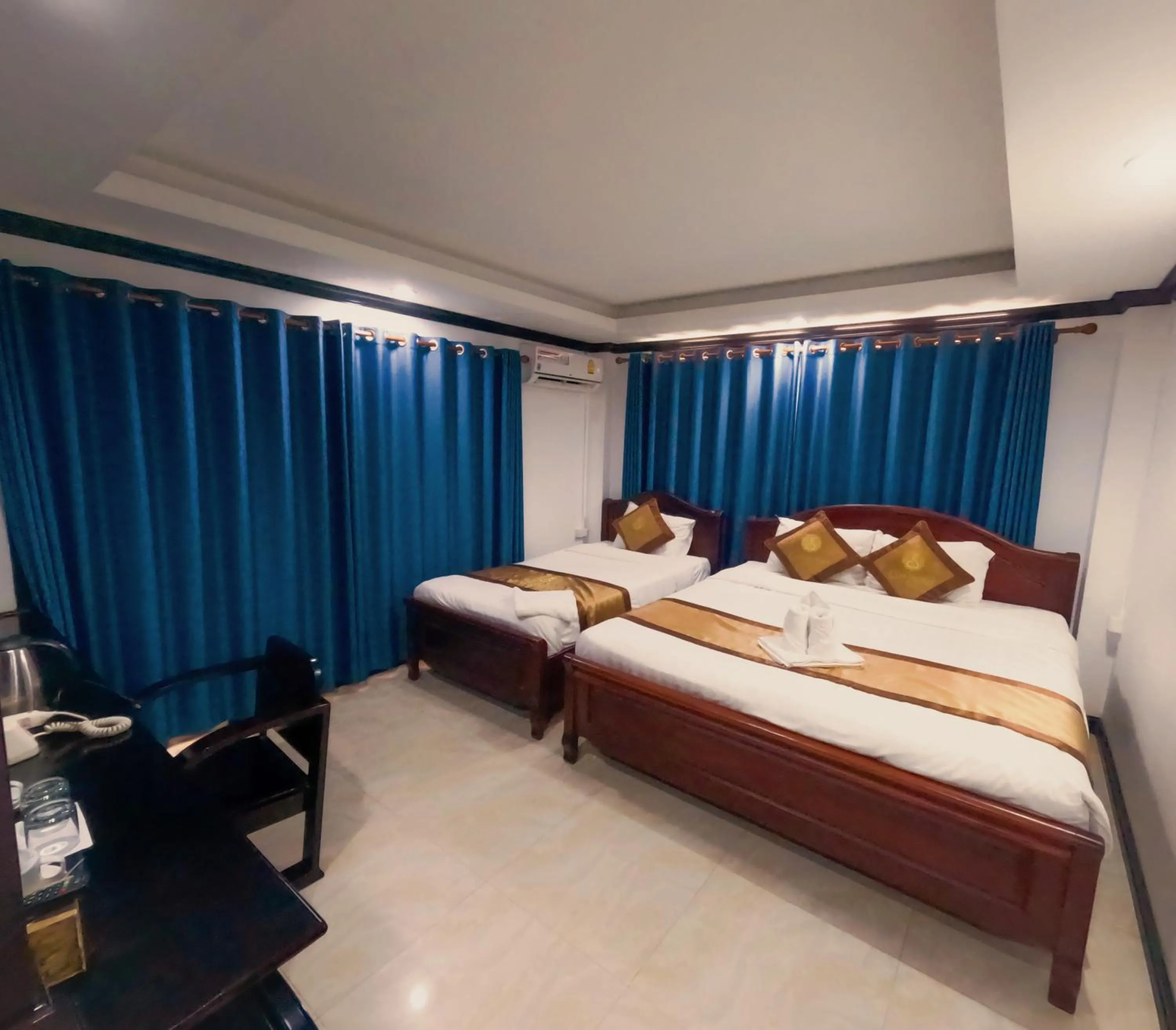 Bed in Vang Vieng Consiana Hotel