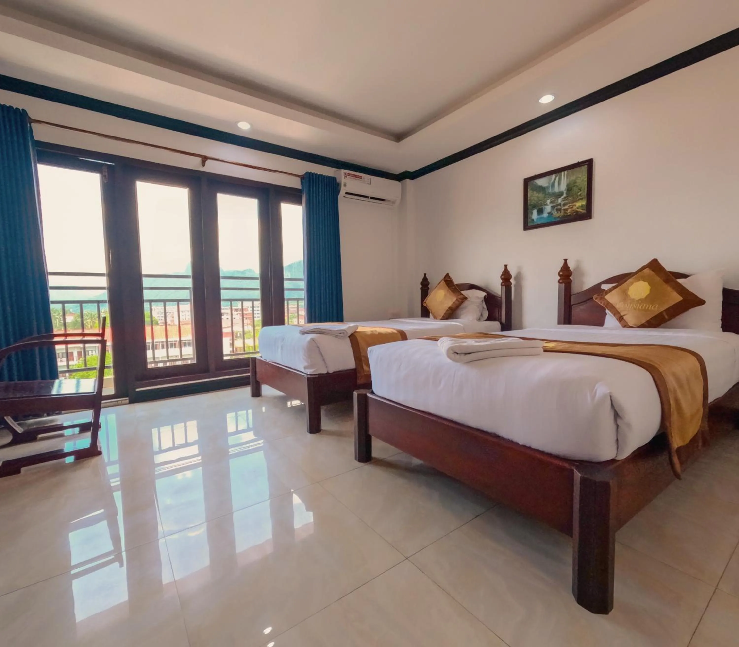 Photo of the whole room, Bed in Vang Vieng Consiana Hotel