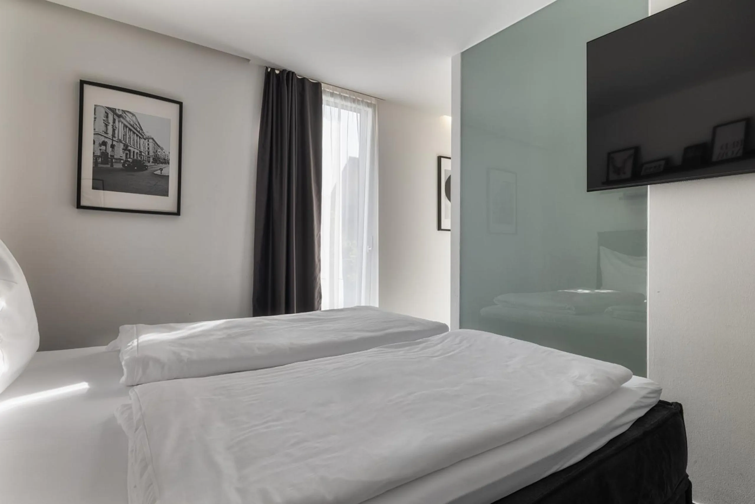 Photo of the whole room, Bed in Motel by Maier Feldkirch - kontaktloser Check-in