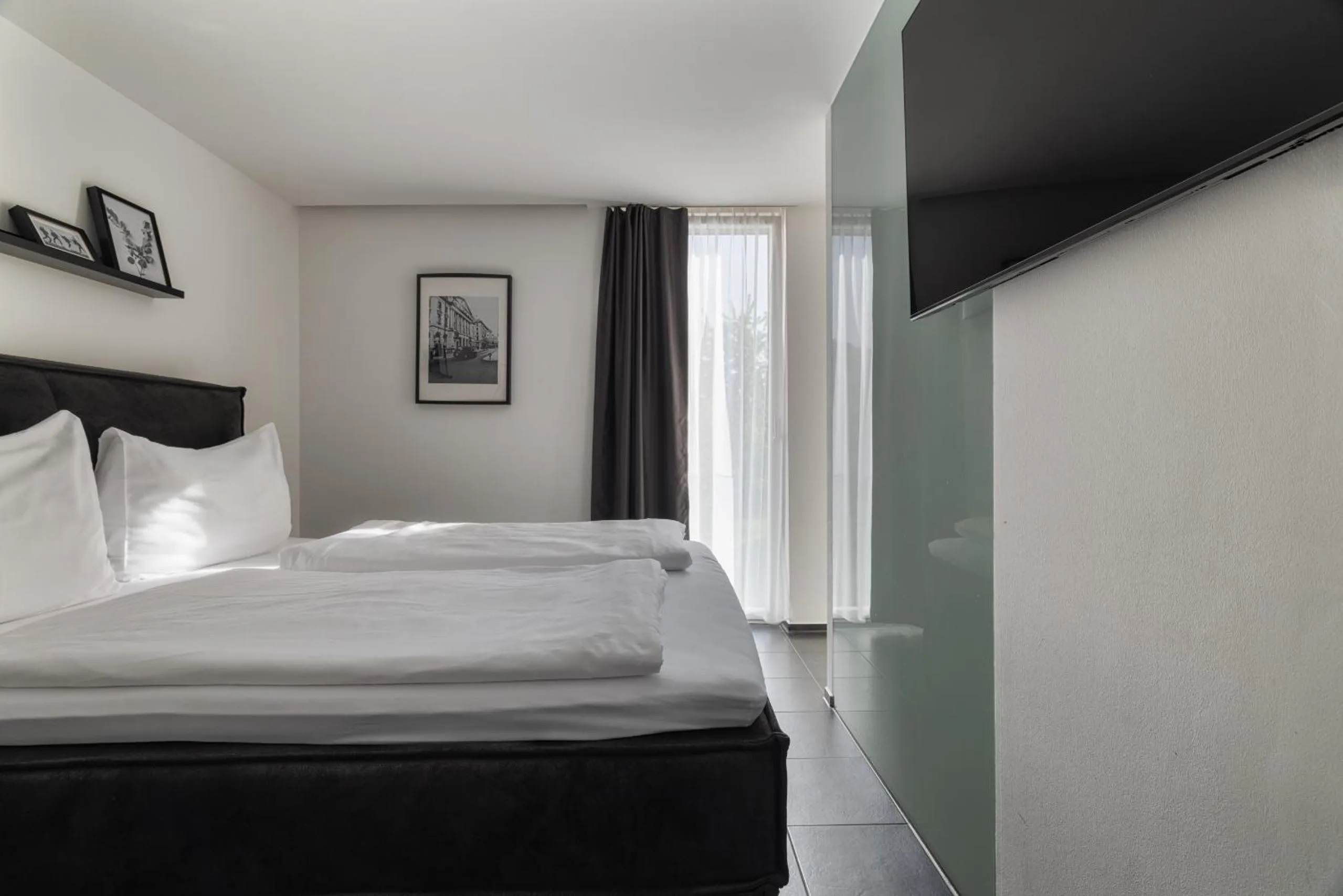 Photo of the whole room, Bed in Motel by Maier Feldkirch - kontaktloser Check-in