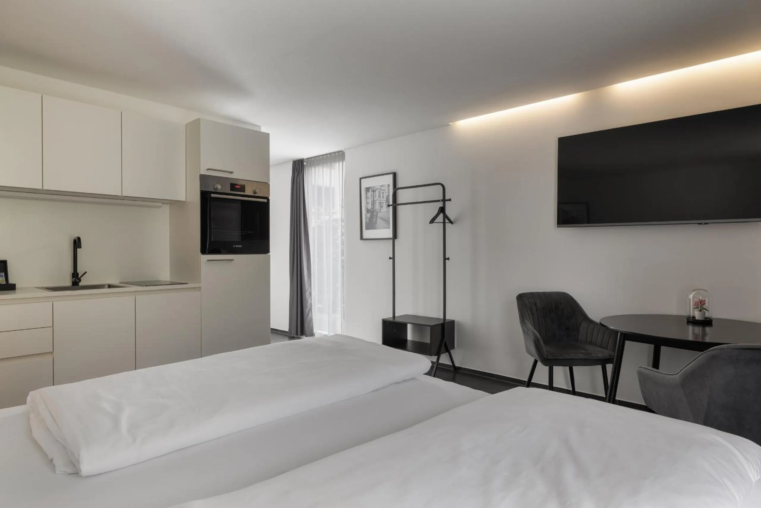 Photo of the whole room, Bed in Motel by Maier Feldkirch - kontaktloser Check-in