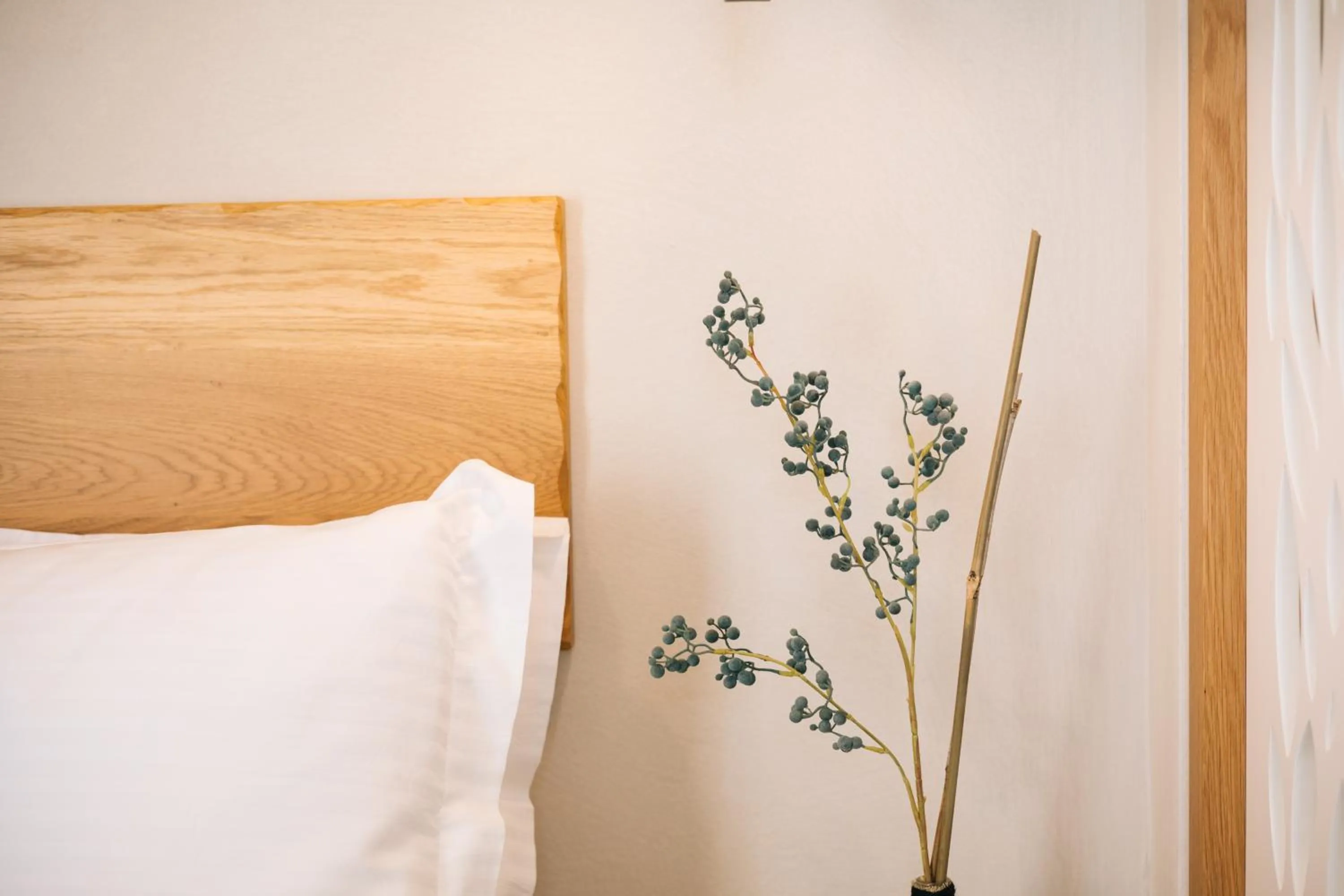 Bed in Mirthea Suites