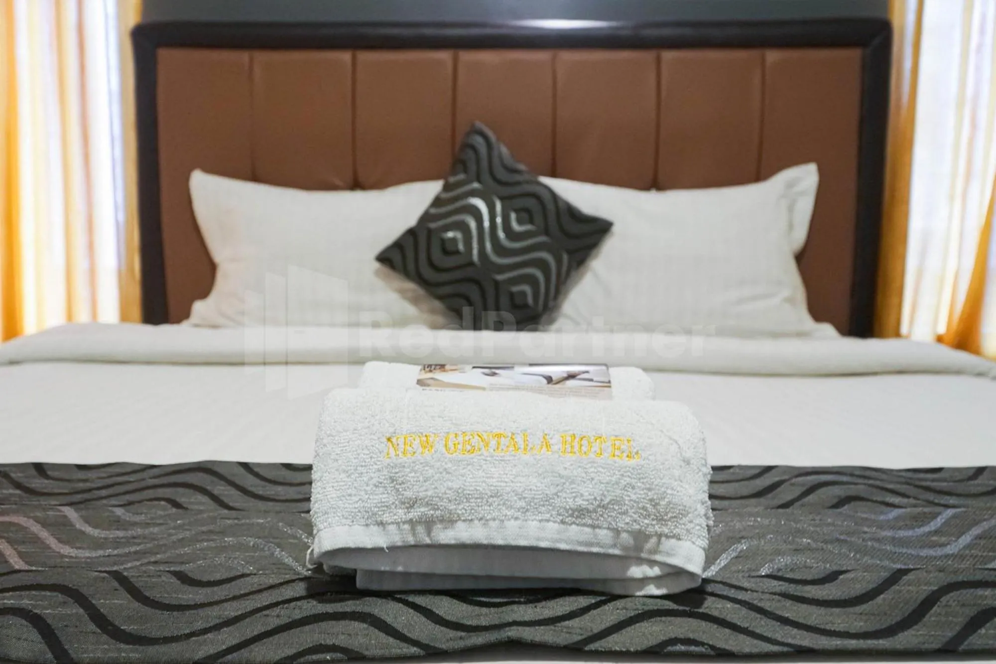 Bed in New Gentala Hotel Medan RedPartner