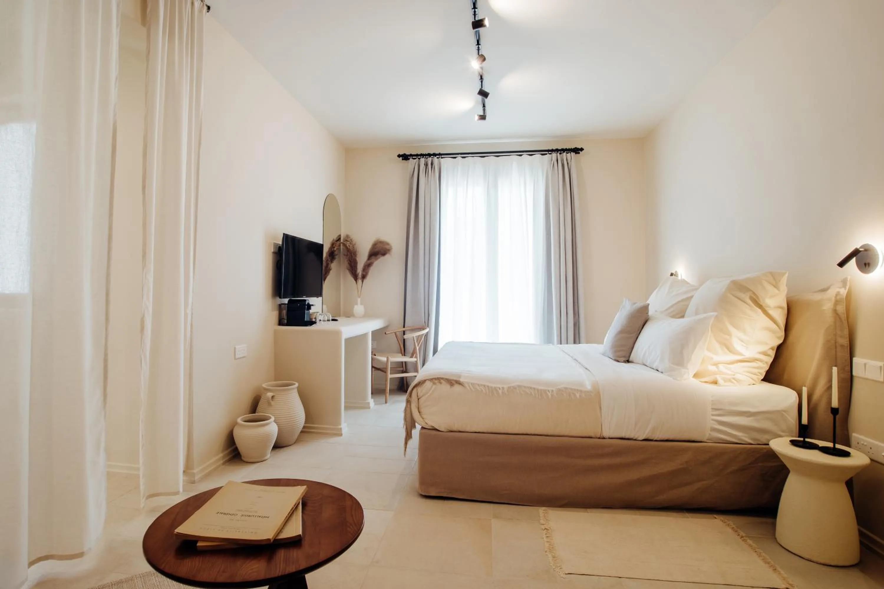 Bed in Thymises Boutique Hotel