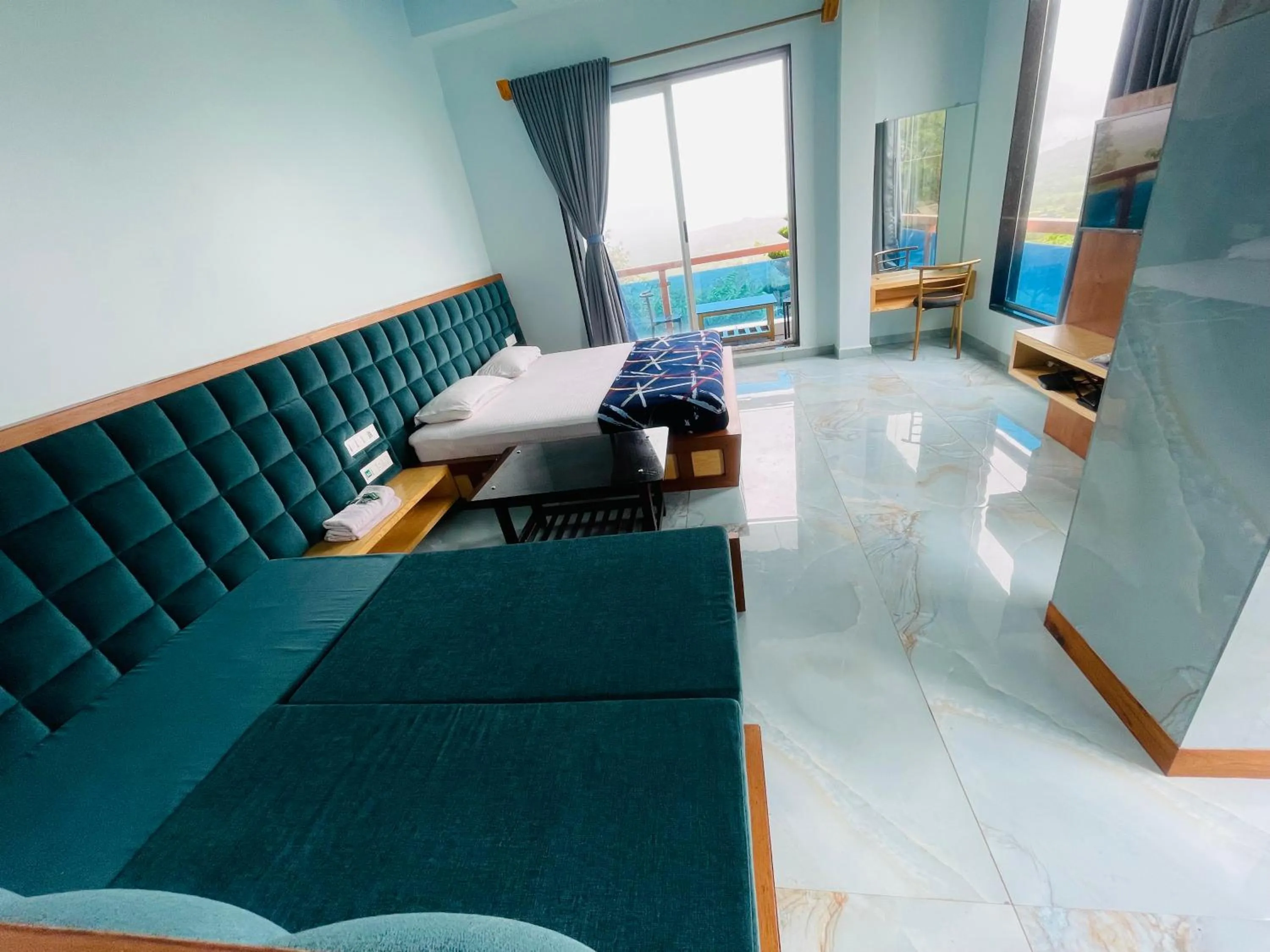 Bed in hotel saptarang residency panhala
