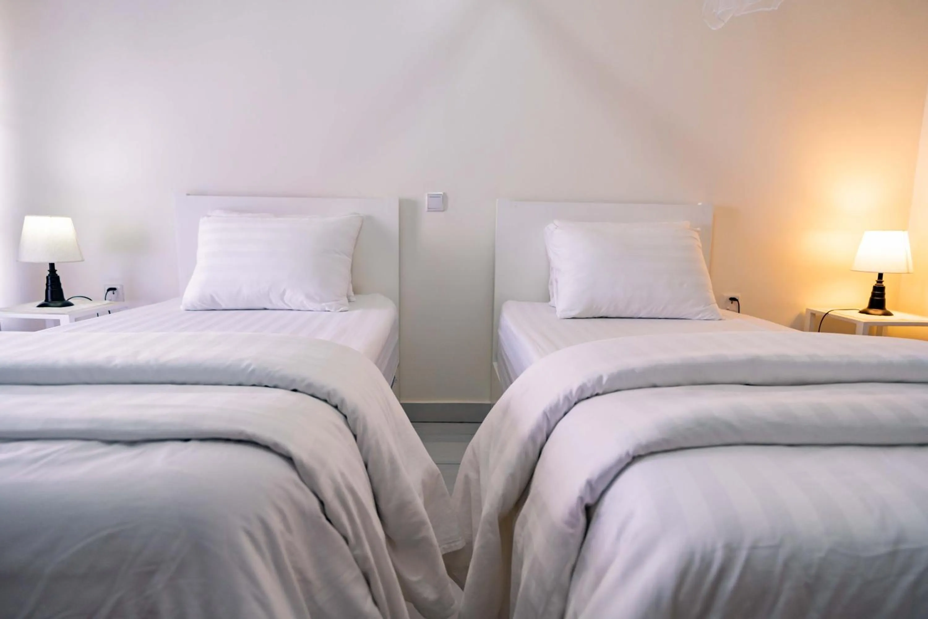 Bed in Blue Veil Villa Hotel