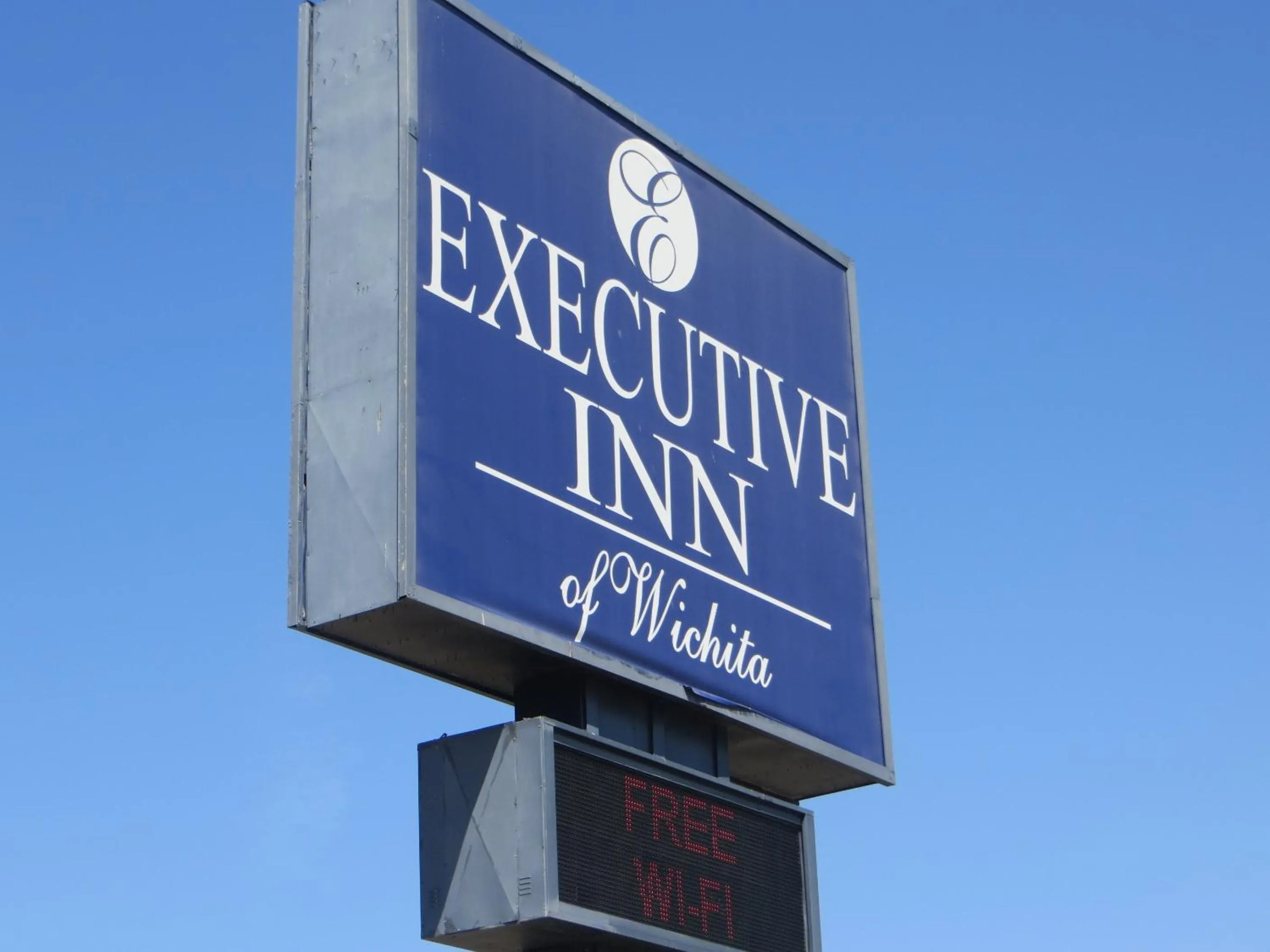 Property logo or sign in Executive Inn Wichita