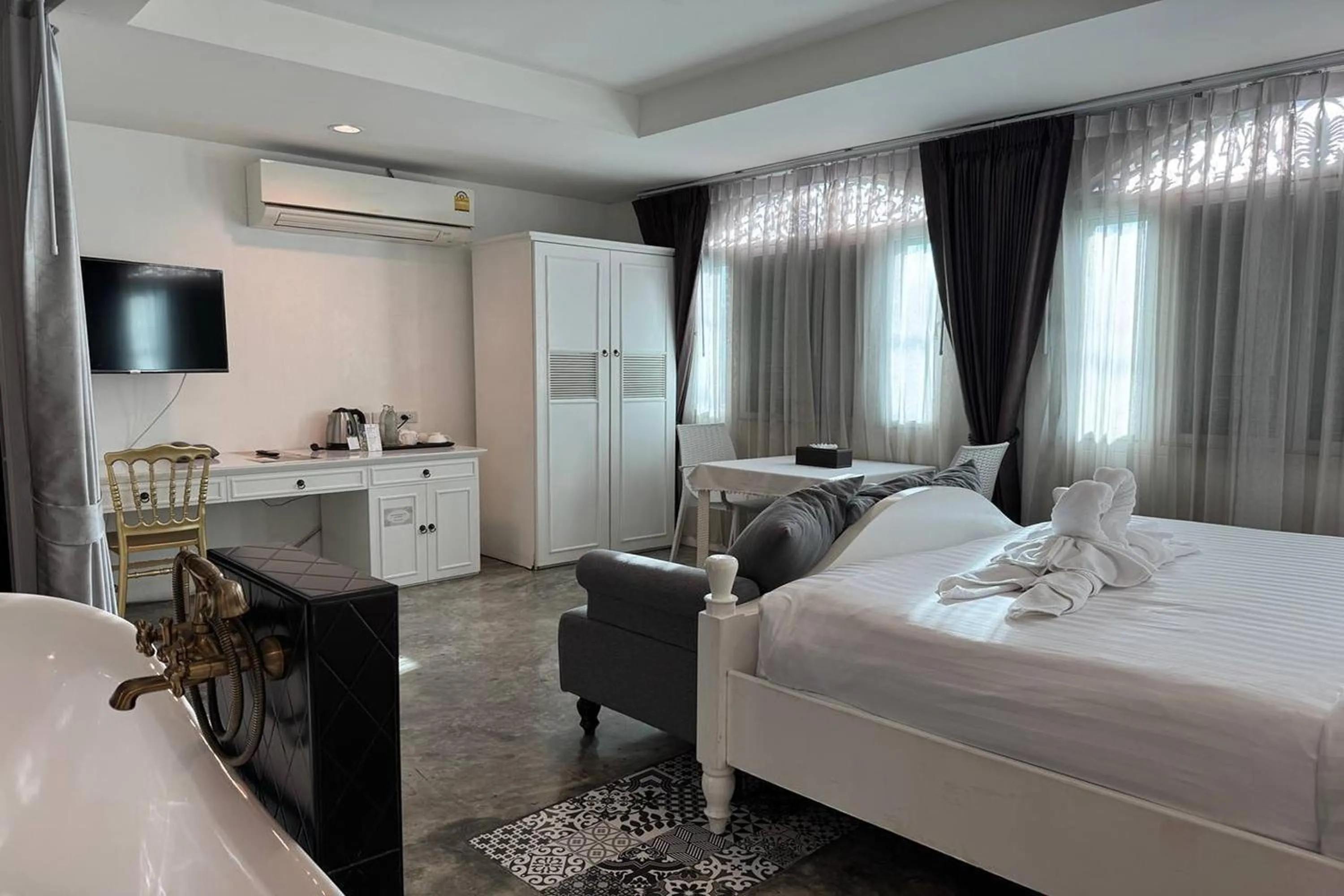 Photo of the whole room, Bed in Nidhra Lanna Hotel Chiang Mai