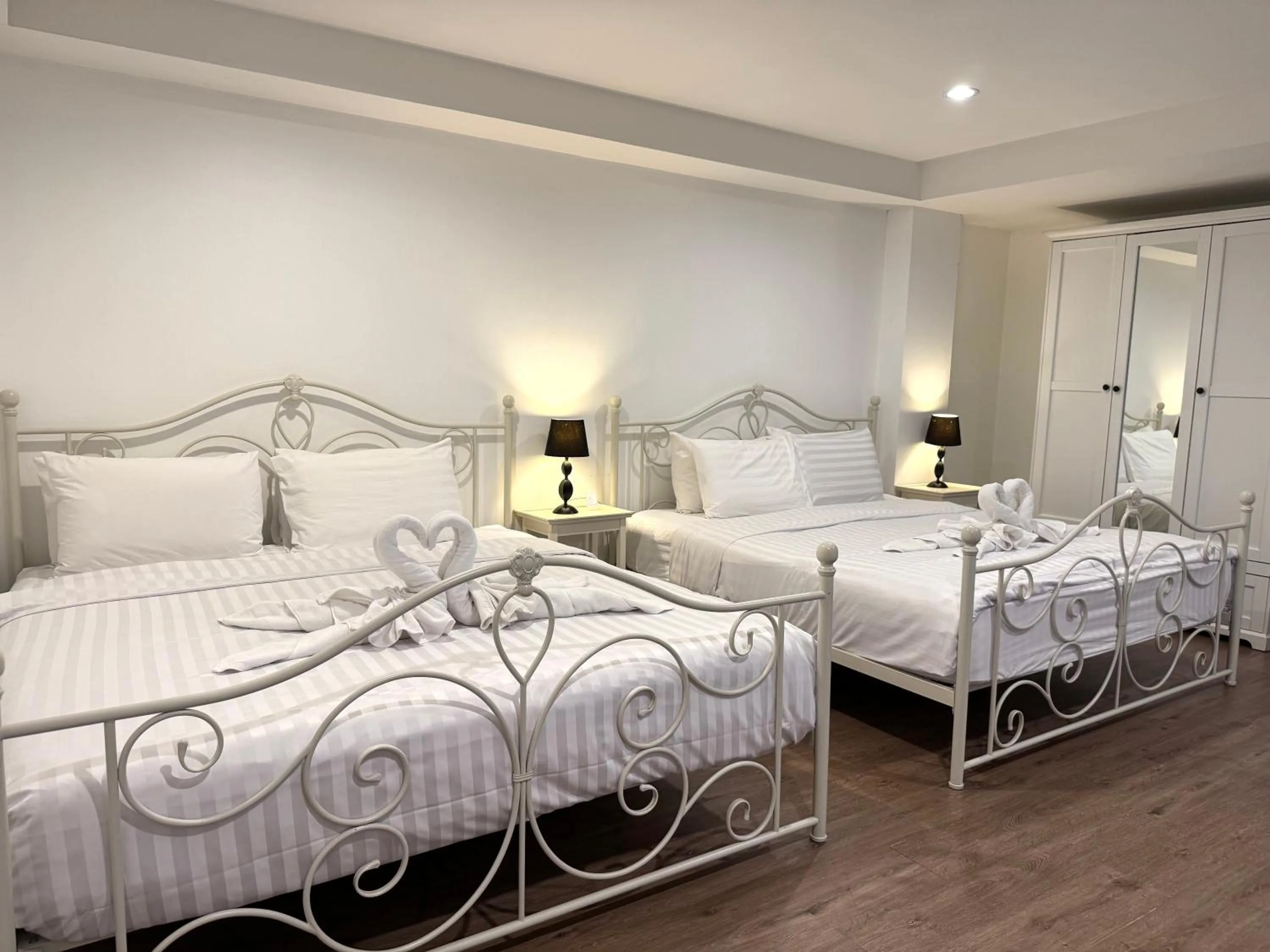 Bed in Nidhra Lanna Hotel Chiang Mai