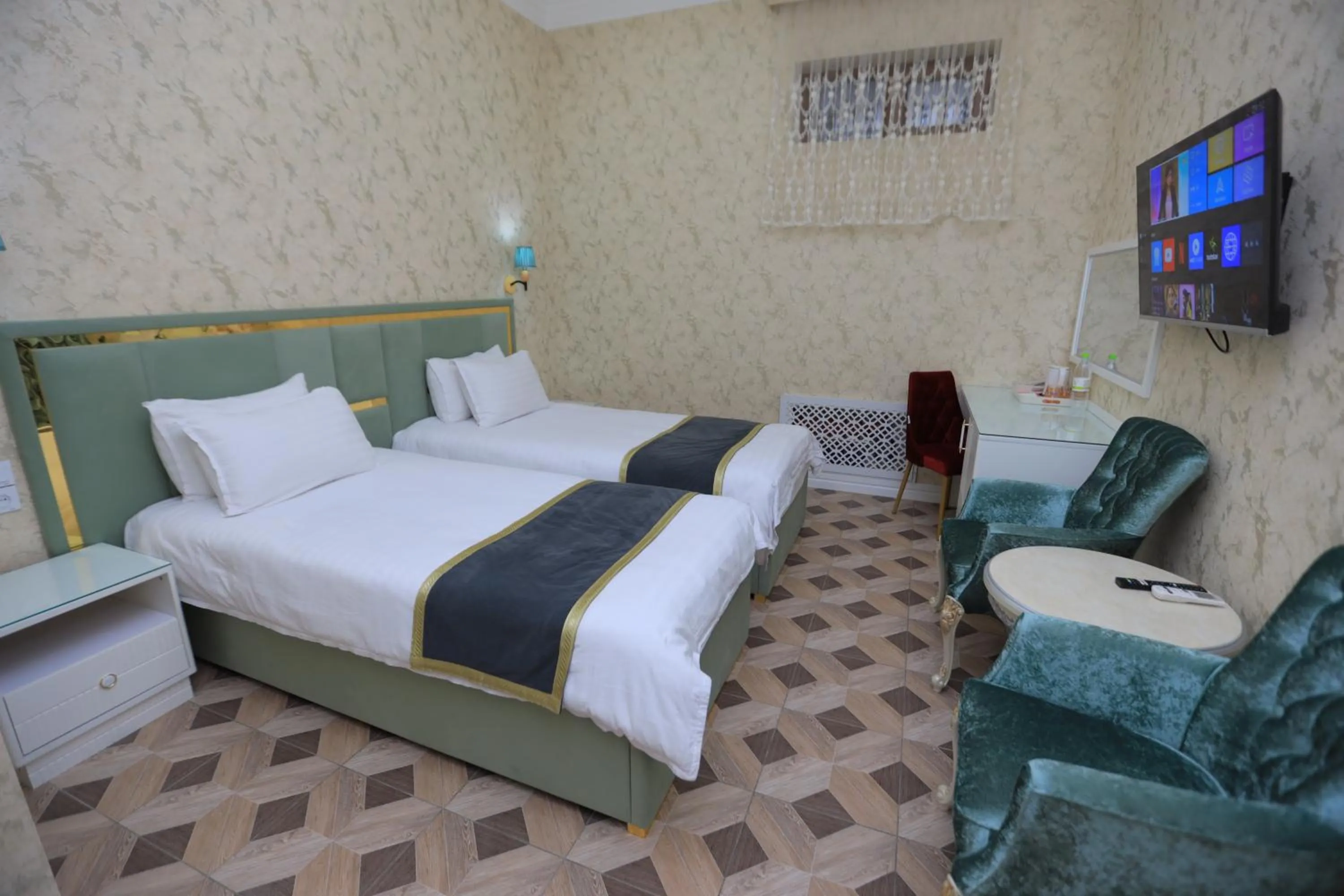 Bed in AYNIY Hotel