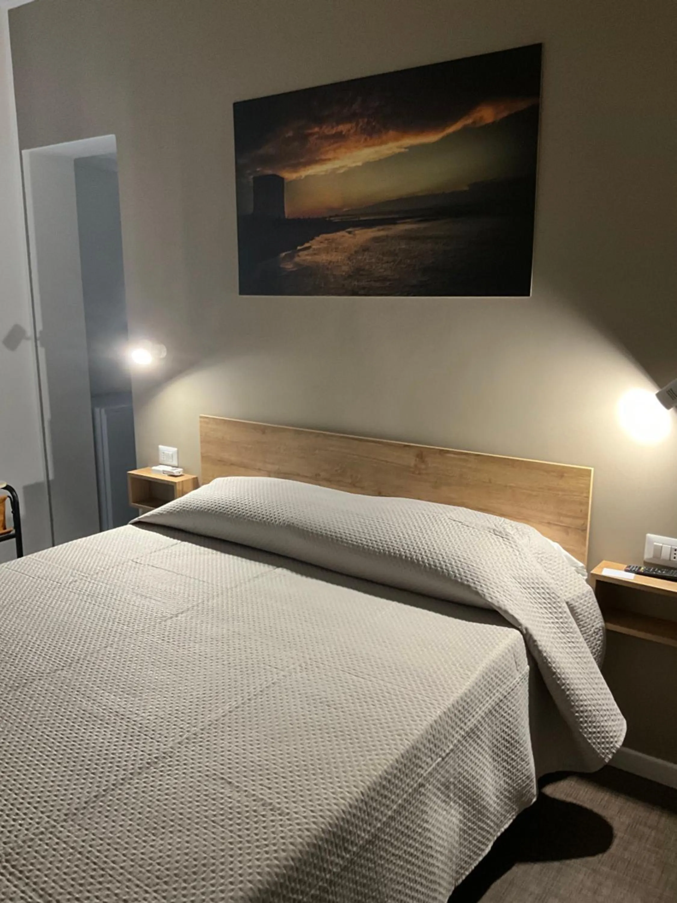 Bed in M&M rooms Margherita di Savoia