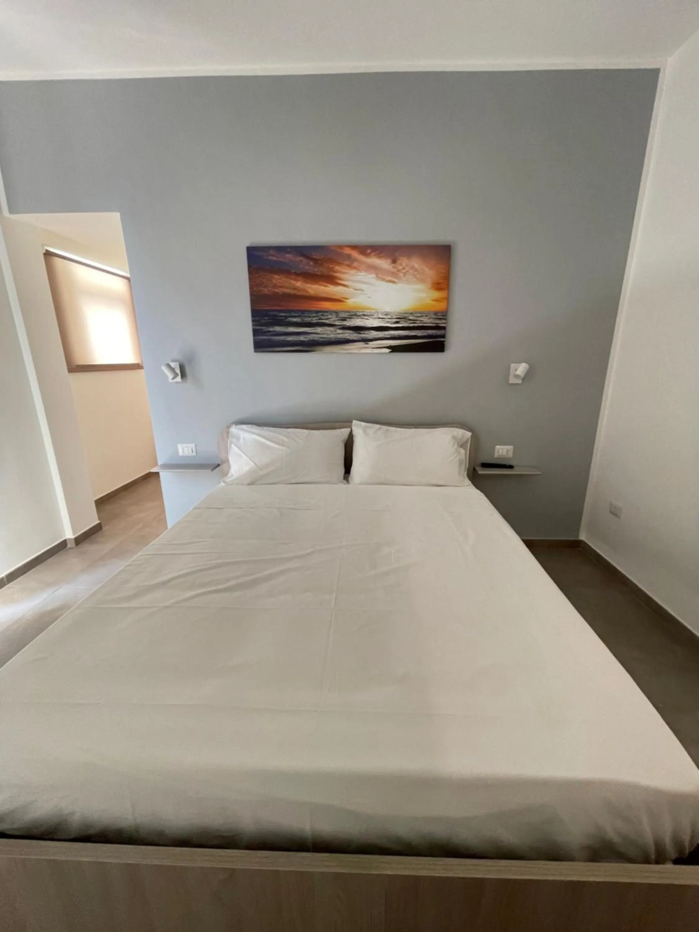 Bed in M&M rooms Margherita di Savoia