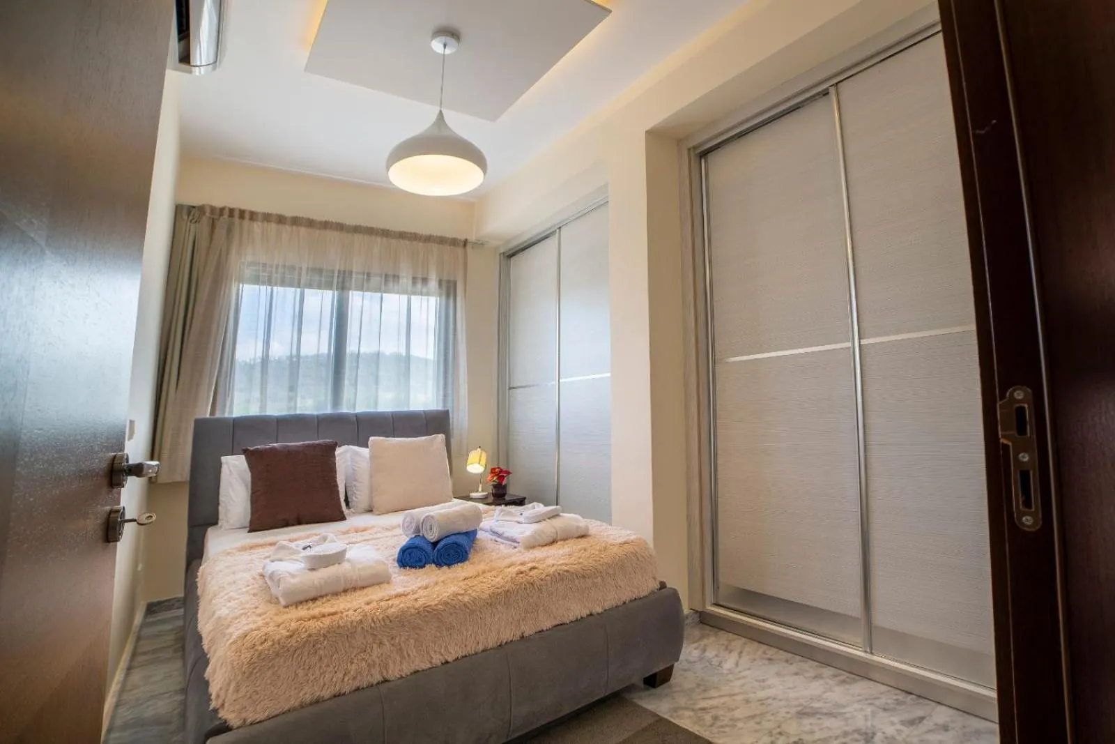 Bed in Latchi Escape Hotel and Suites