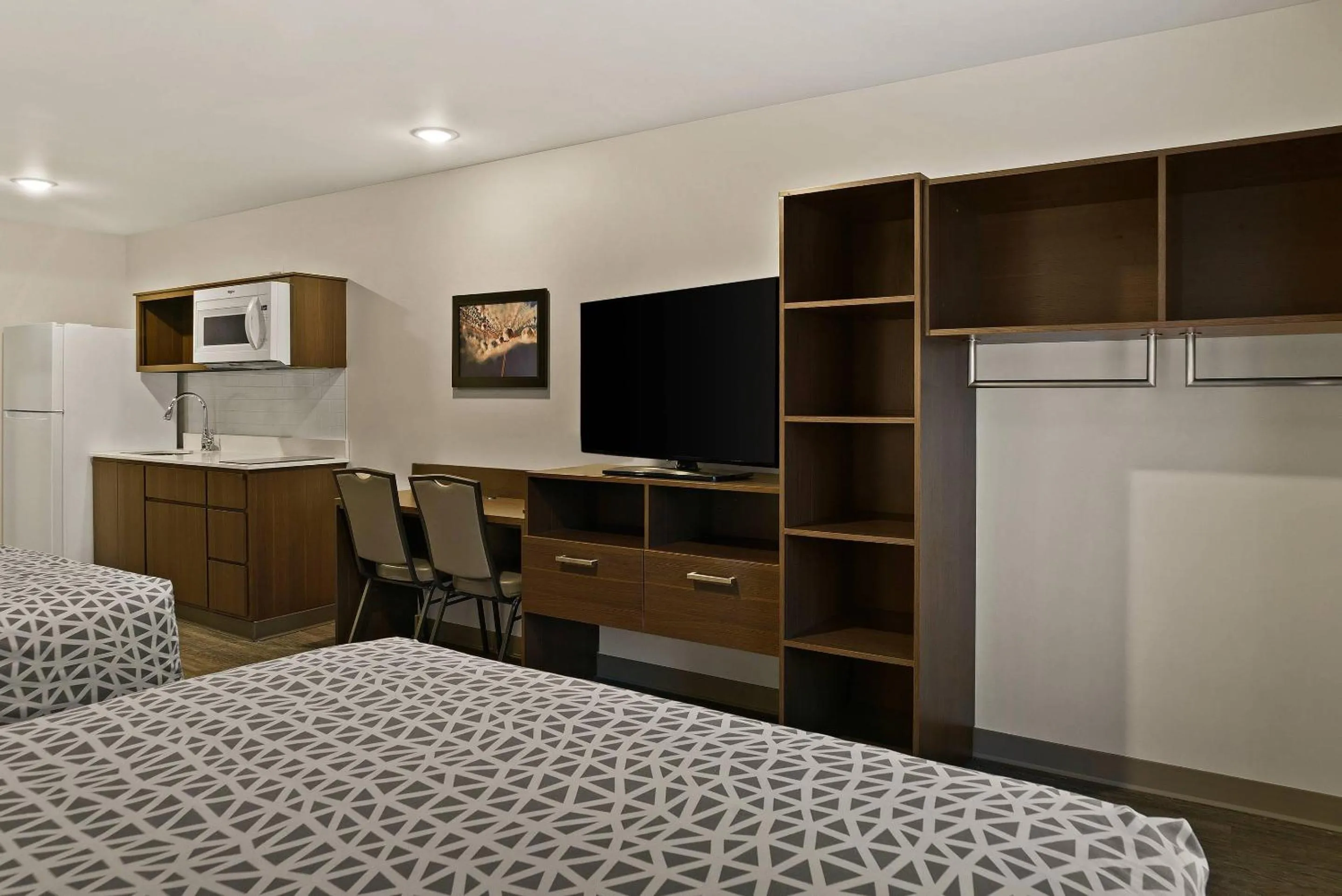 Bedroom, Bed in WoodSpring Suites East Lansing - University Area