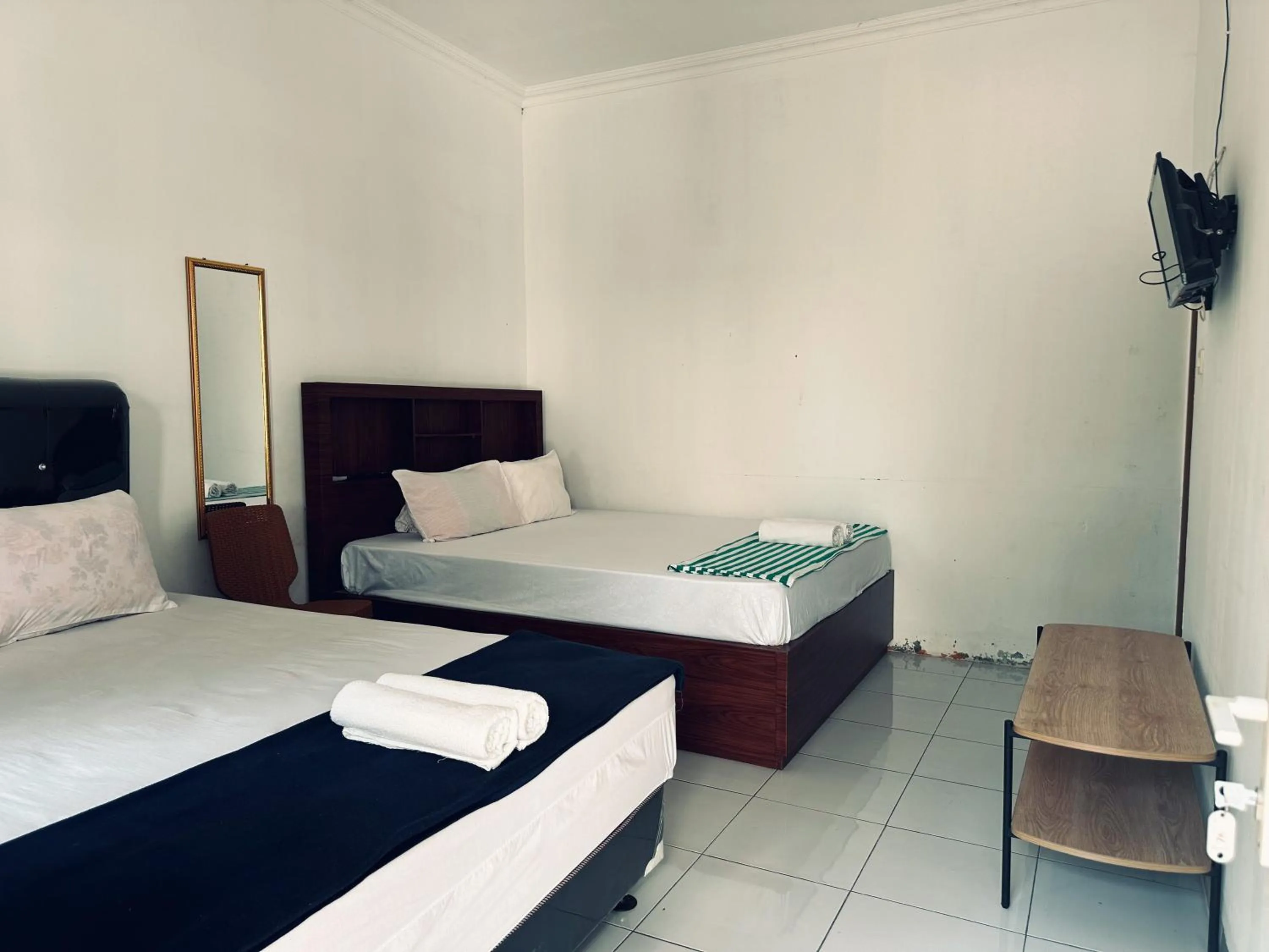 Bed in Guest House Hj Muriyah Syariah Slawi Mitra RedDoorz