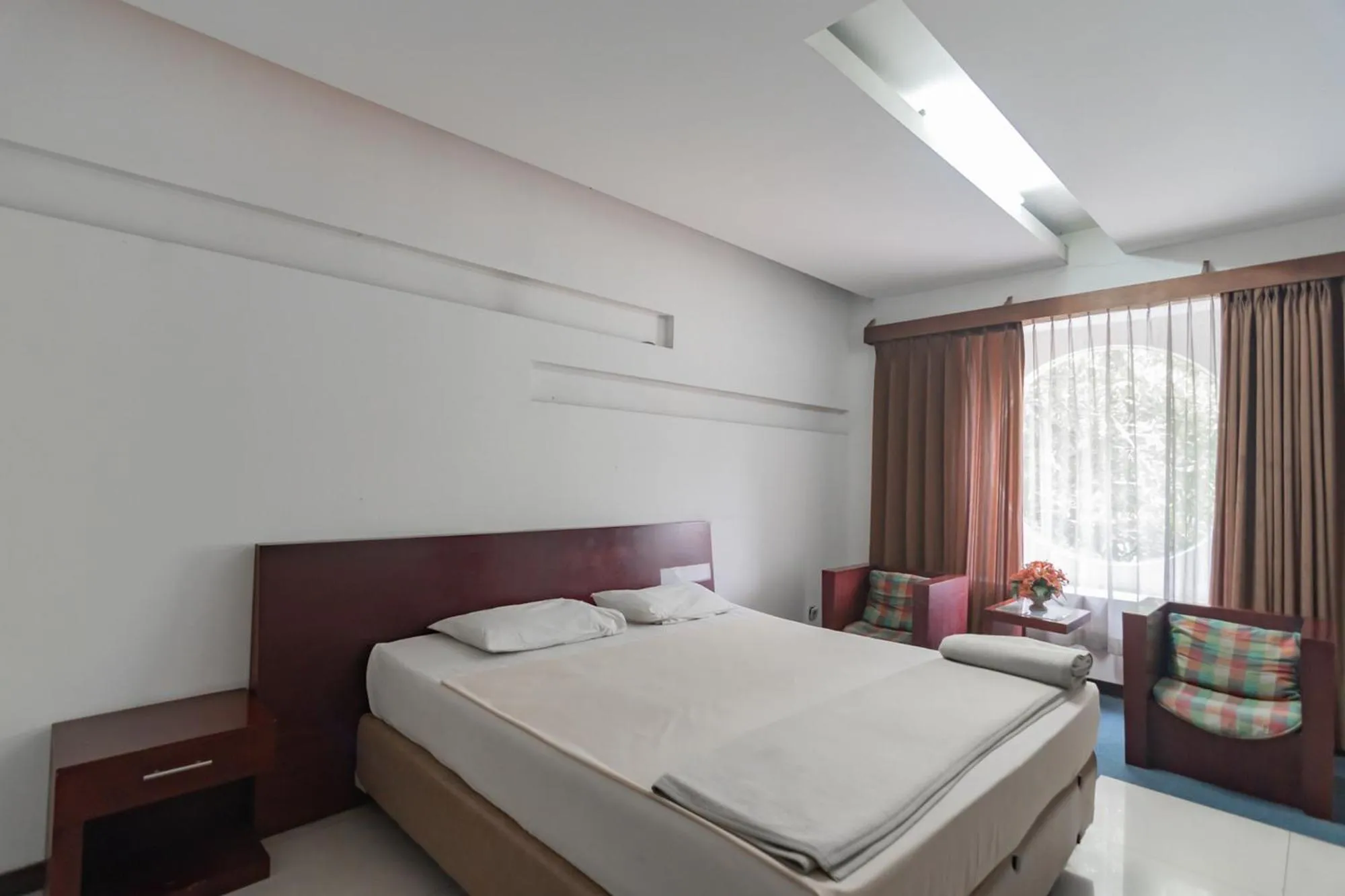 Bed in Istana Hotel Bandung Mitra RedDoorz