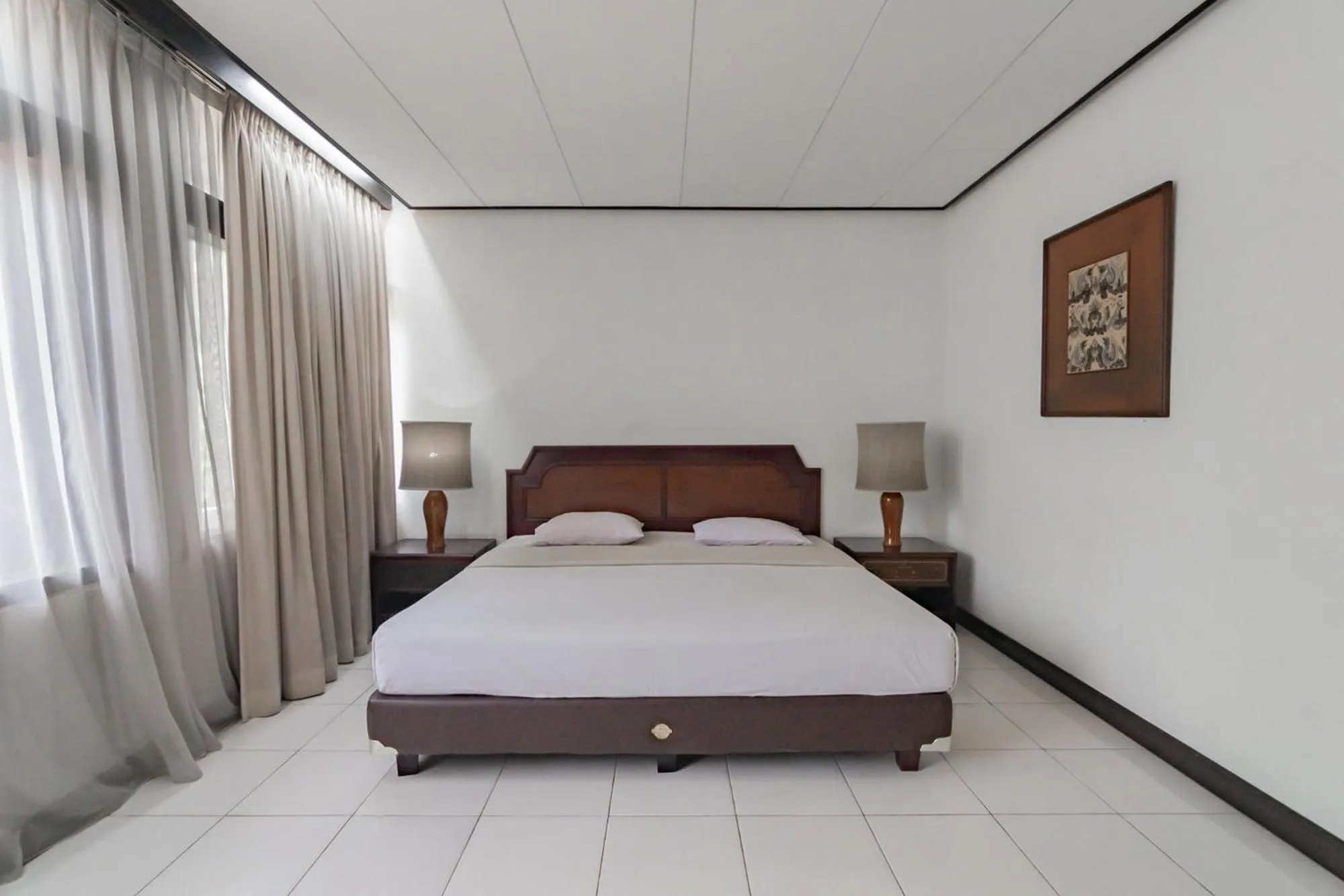 Bed in Istana Hotel Bandung Mitra RedDoorz