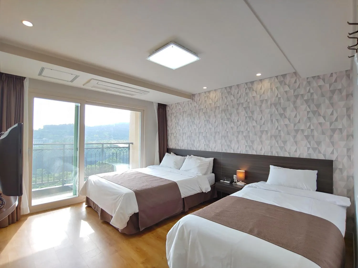 Bed in Jeju Lavender Hotel