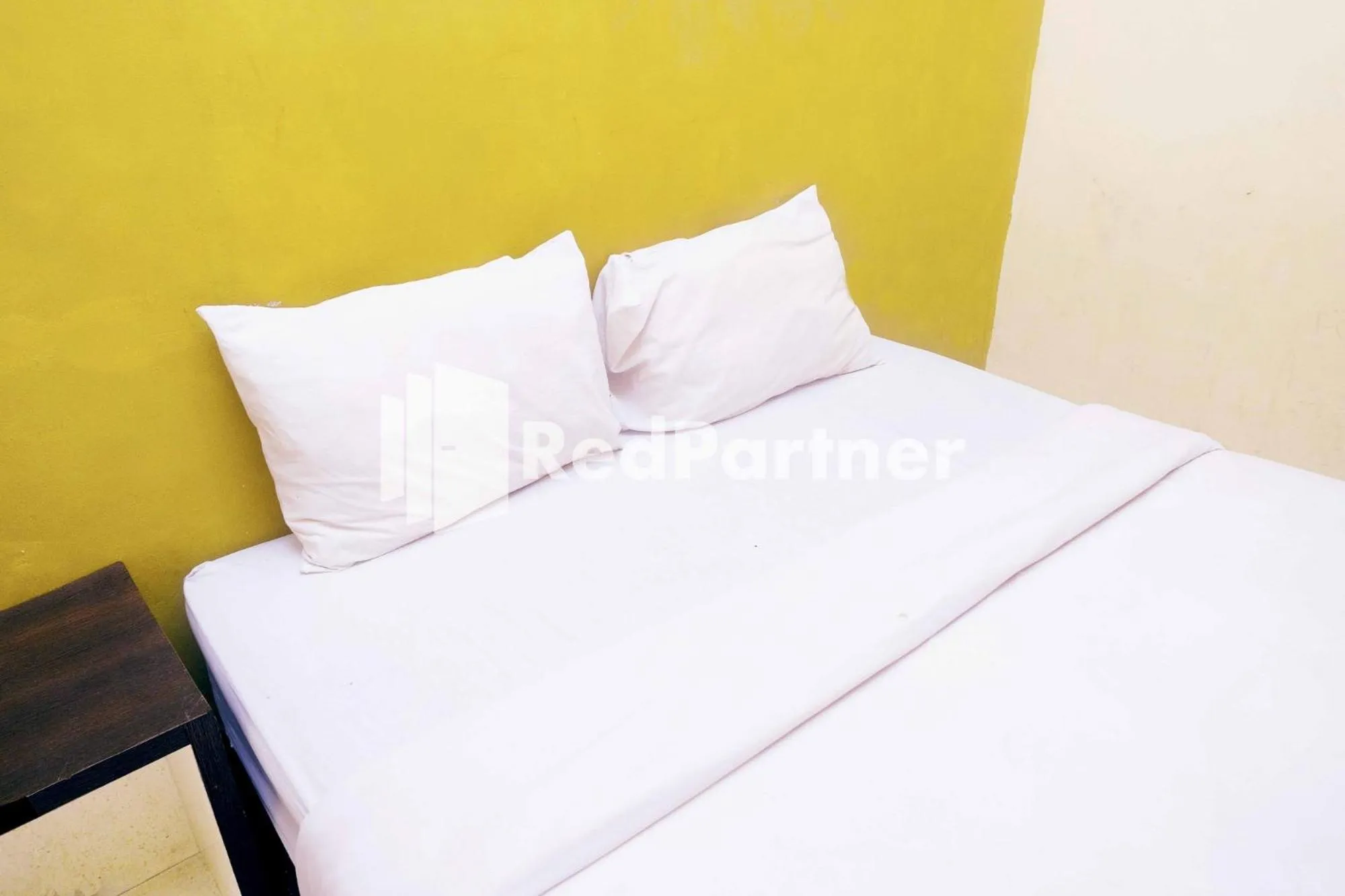 Bed in Hotel Permata Makassar Mitra RedDoorz