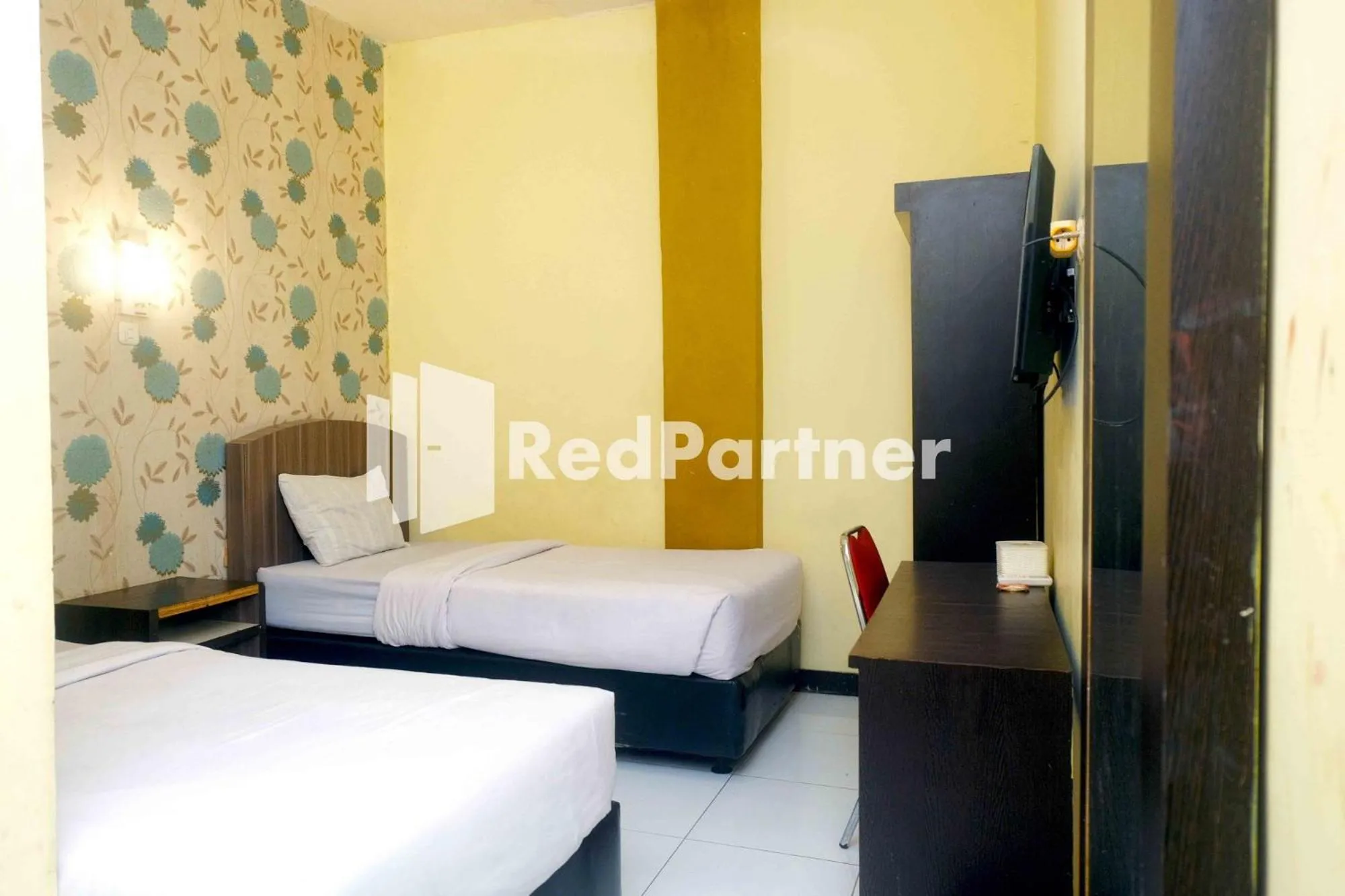 Bed in Hotel Permata Makassar Mitra RedDoorz