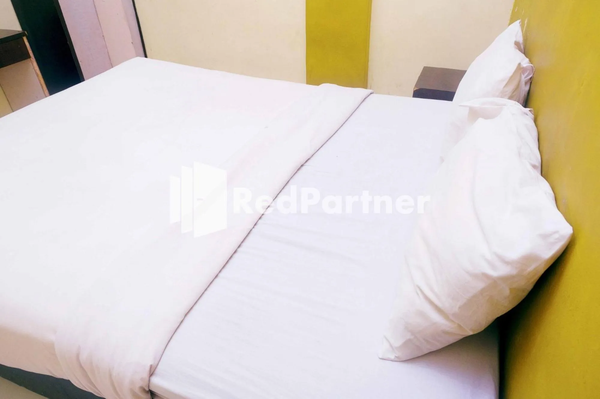 Bed in Hotel Permata Makassar Mitra RedDoorz