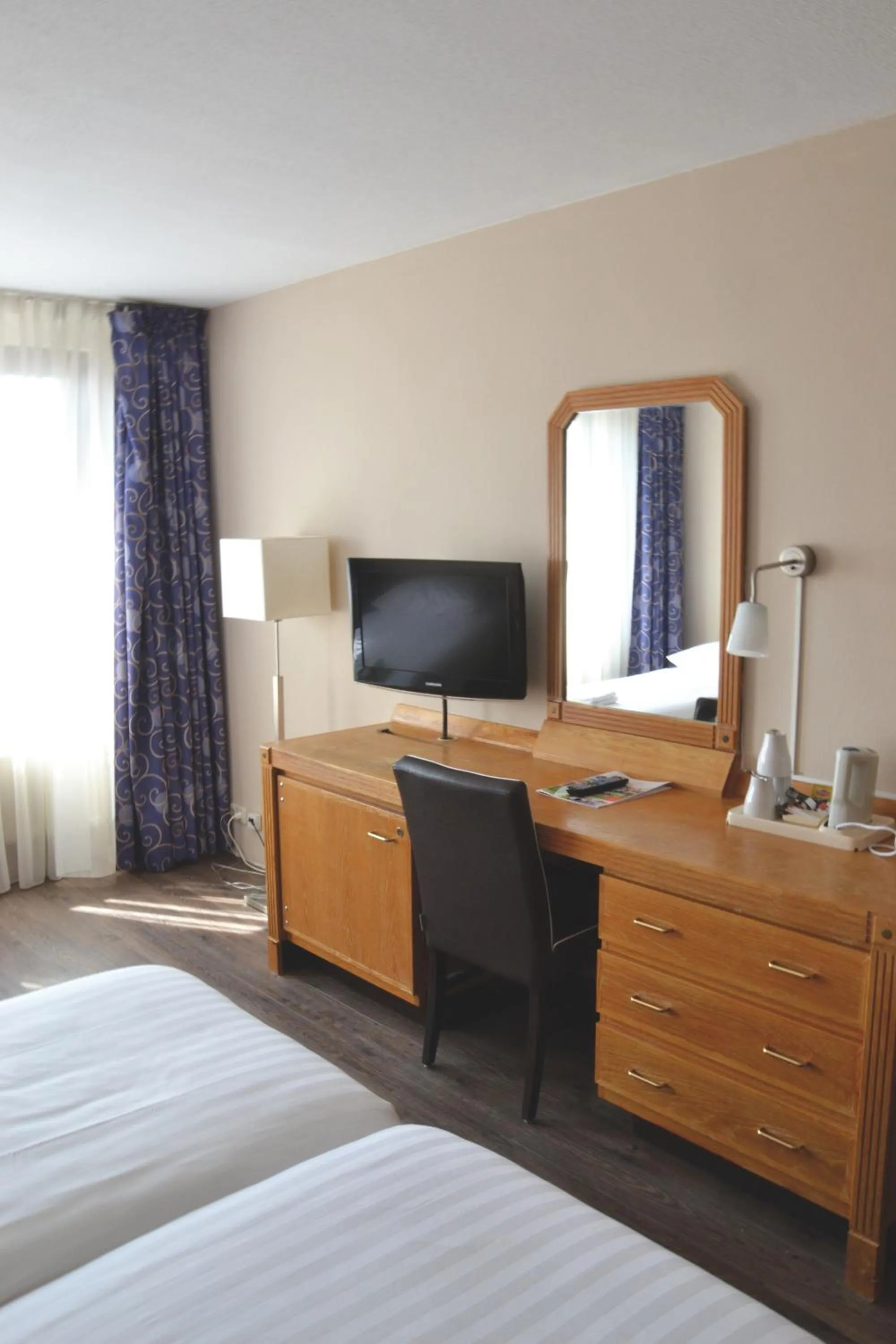 Photo of the whole room, TV/Entertainment Center in Fletcher Hotel Restaurant Carlton