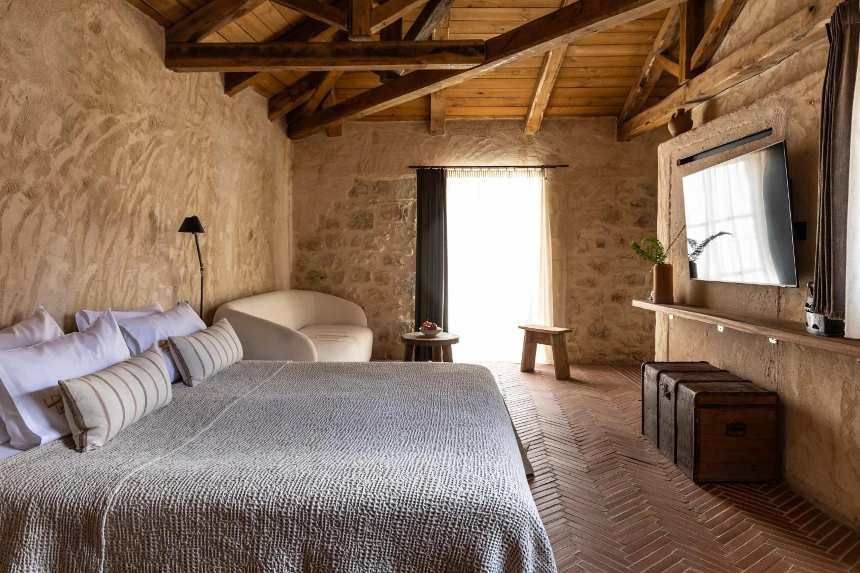 Bed in Amalen Suites Adults Only